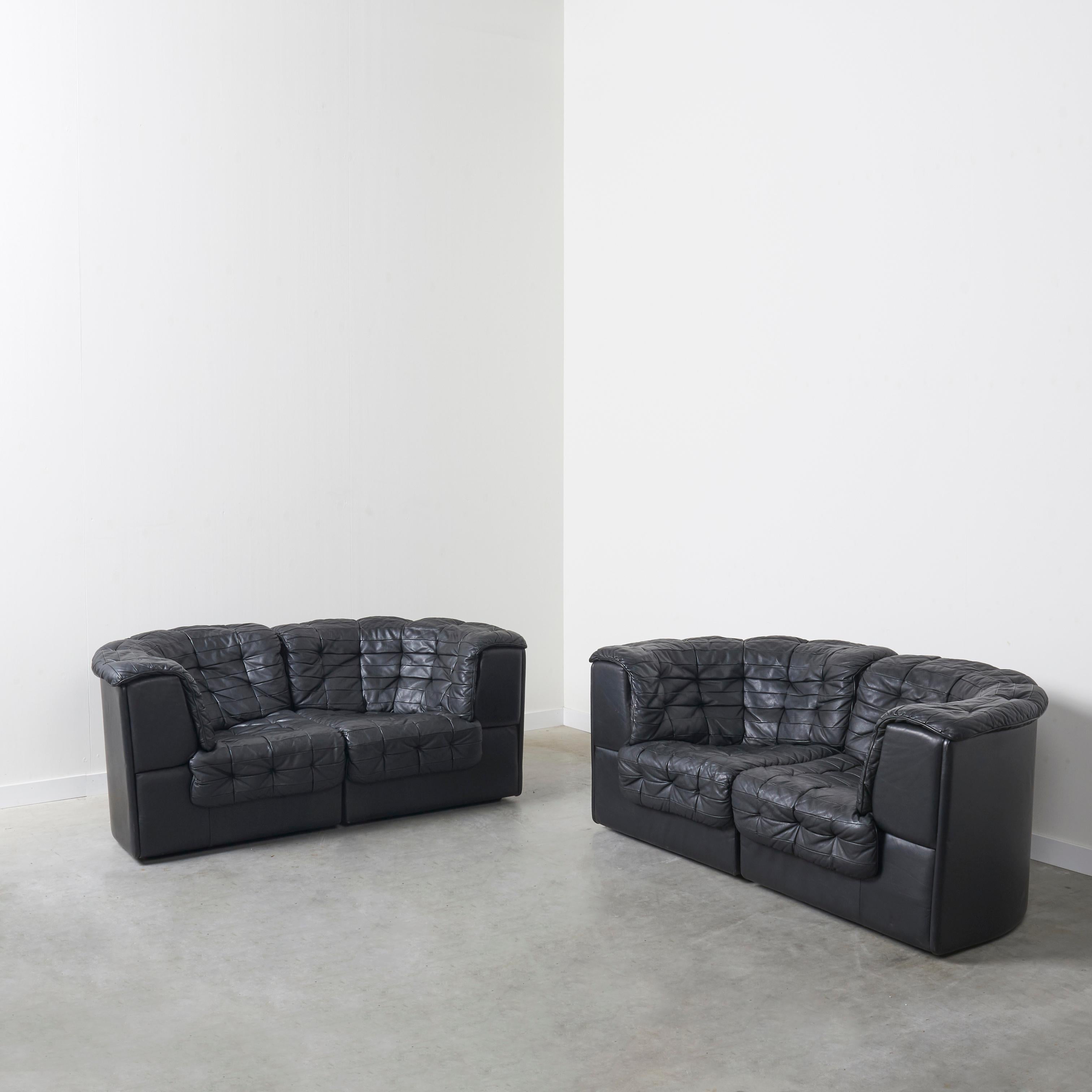 Set modular sofas by De Sede, model DS 11, Switzerland 1970s.
Each set contains a left and right element.
Black leather patchwork upholstery.
All elements in excellent condition.