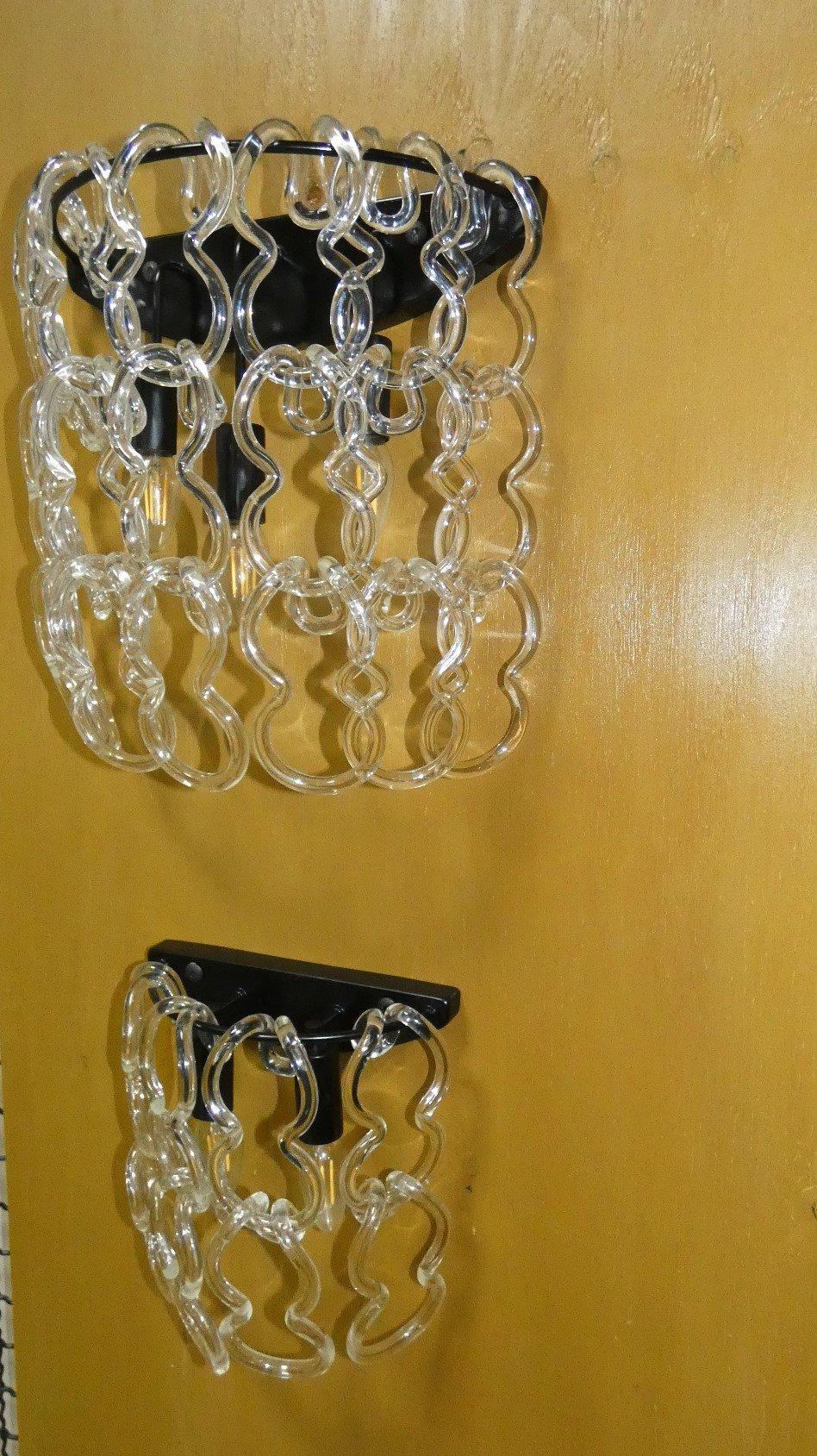 Giogali AP no es simplemente un aplique de cristal... es un sistema de iluminación decorativa basado en el elemento modular de gancho de pirex.
Aplique compuesto por elementos de pirex fabricados totalmente a mano y modulables a voluntad.
El