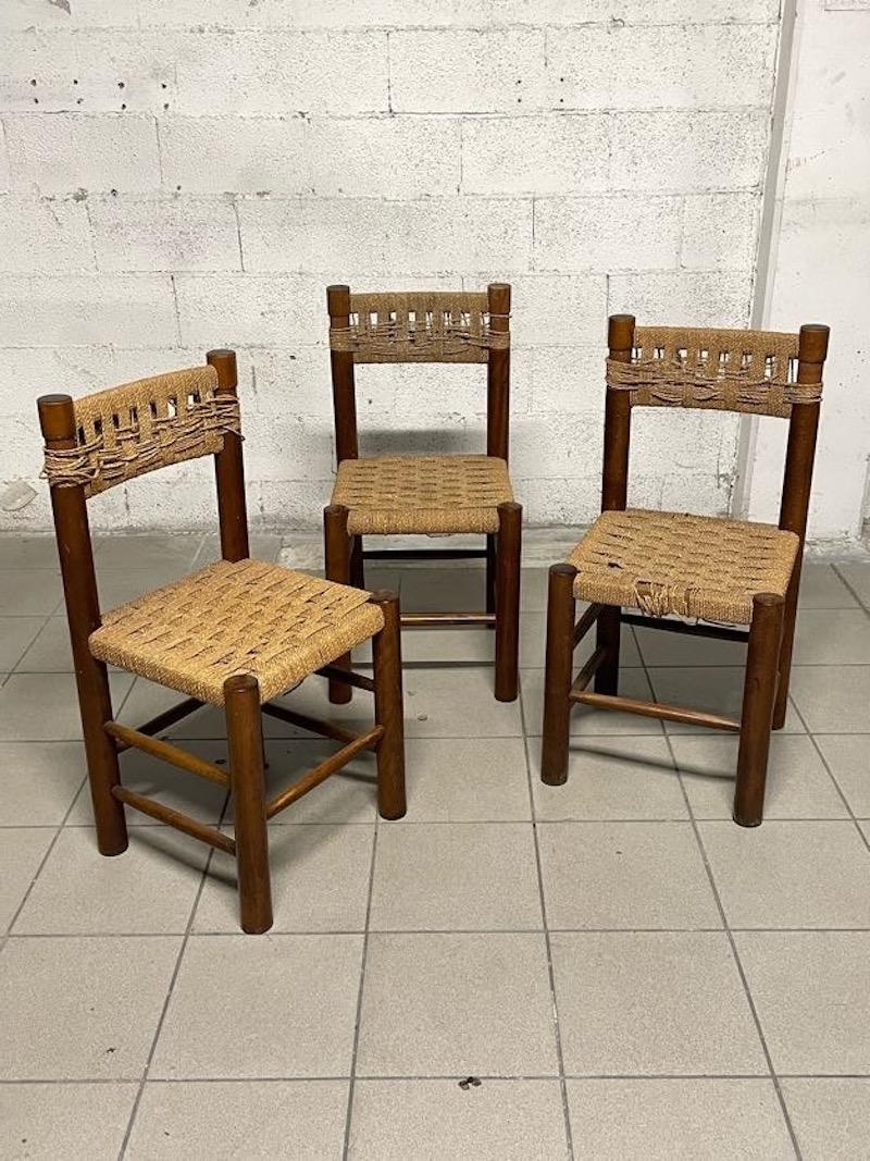 Set of 3 beechwood and straw chairs designed by famous French designer Charlotte Perriand. 

The wooden frame is sound, the thatch of the chairs is in need of redoing, especially, regarding the backs

These are very comfortable and tasteful chairs