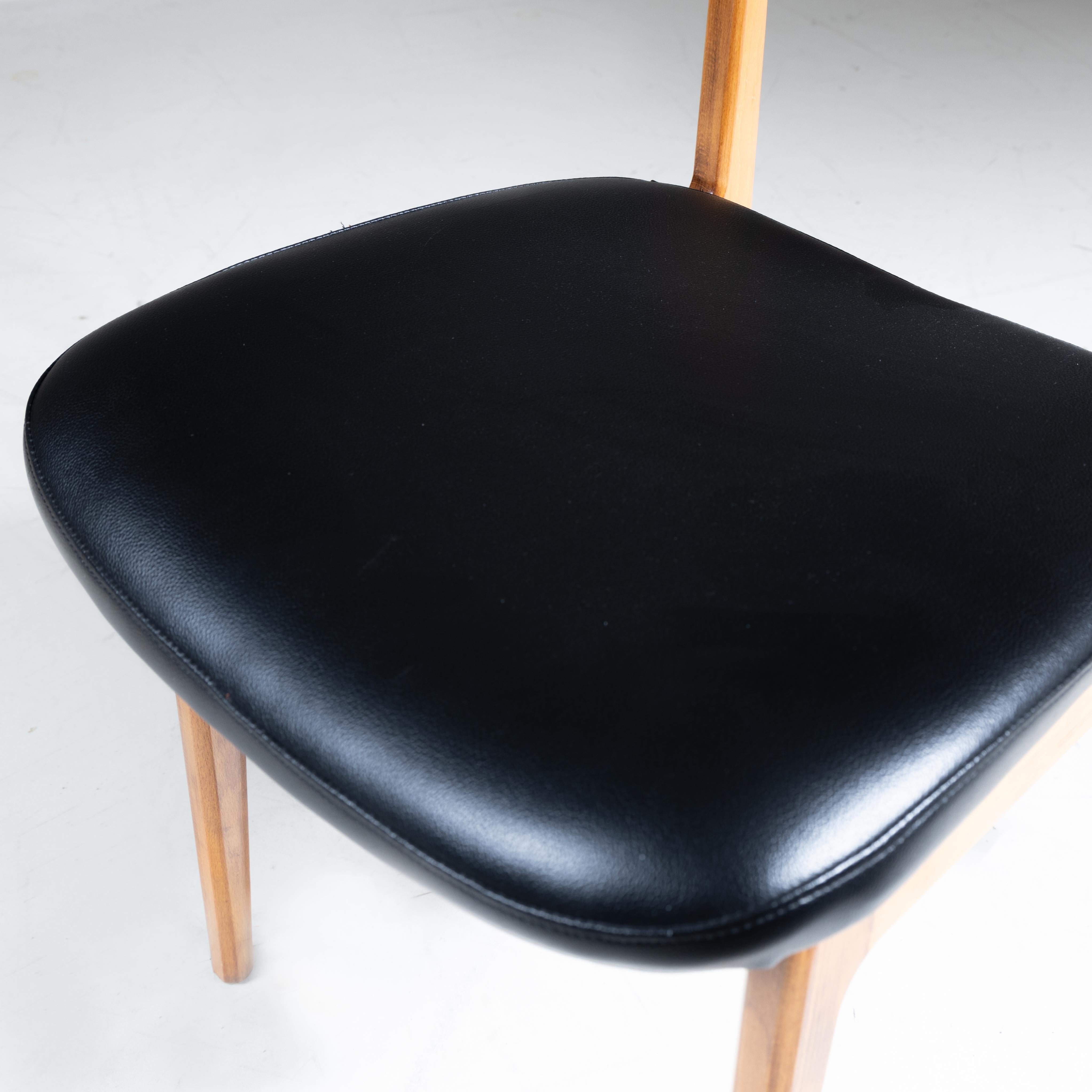 Set of 4 wood and black faux leather chairs, 1960s For Sale 4