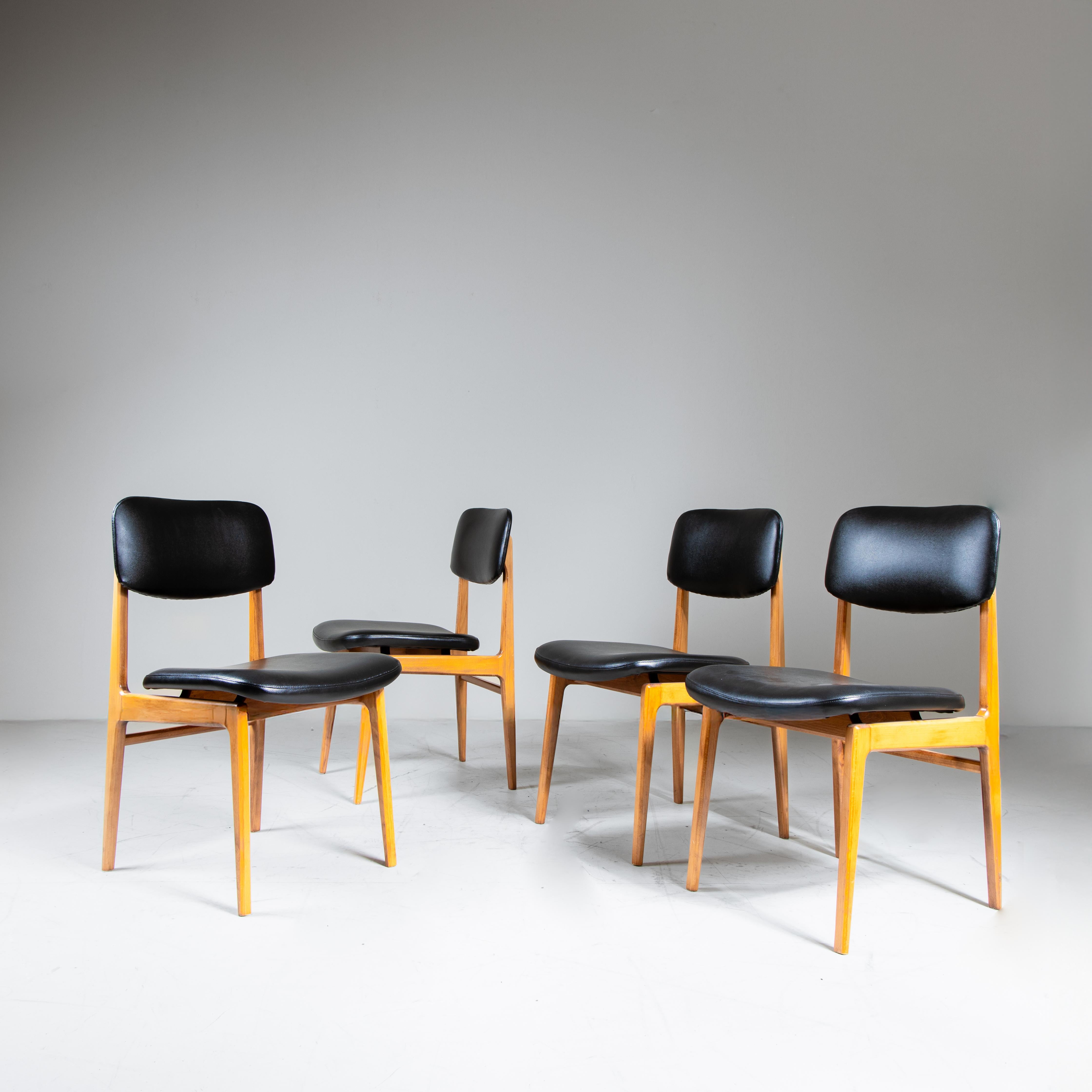 Mid-Century Modern Set of 4 wood and black faux leather chairs, 1960s For Sale