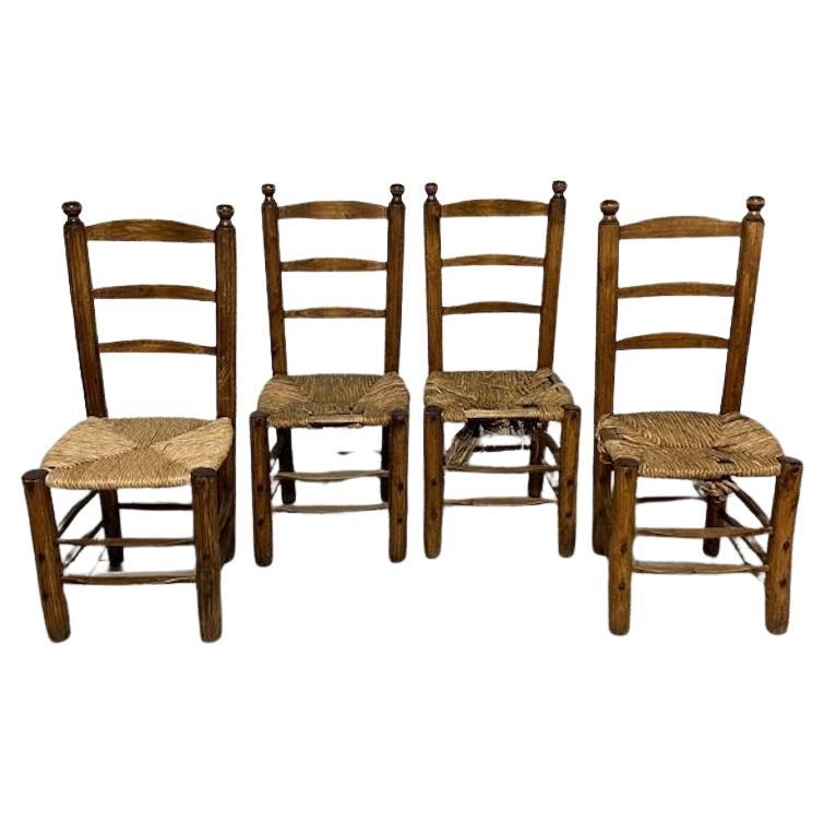 Set of 4 chairs in the style of Charles Dudouyt, France, 1950s