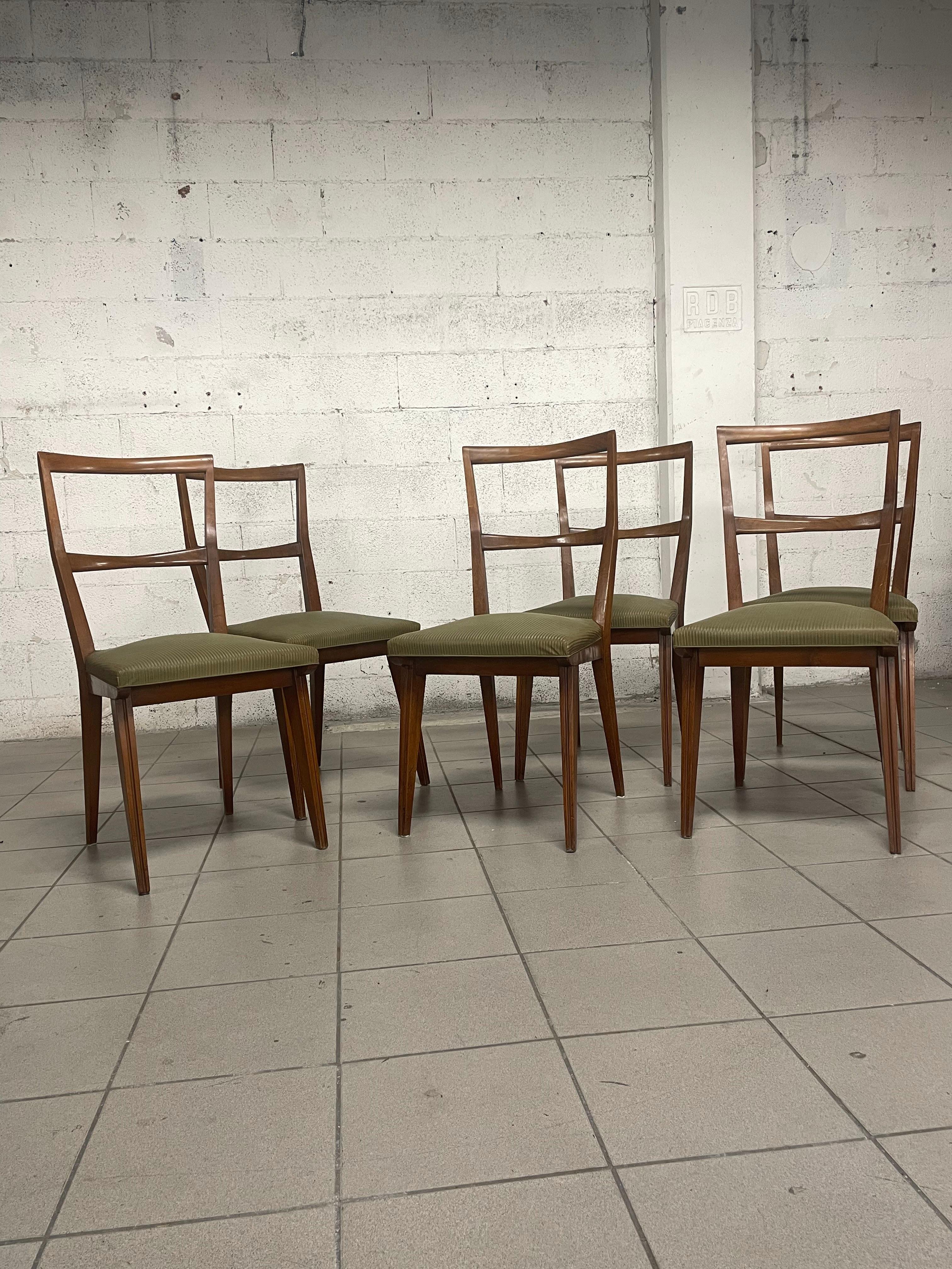 Set of 6 chairs from the 1960s with walnut frame and seat upholstered in green sky, a classic color of that period.

The backrest is slightly curved

The set has not been restored but is in good vintage condition.