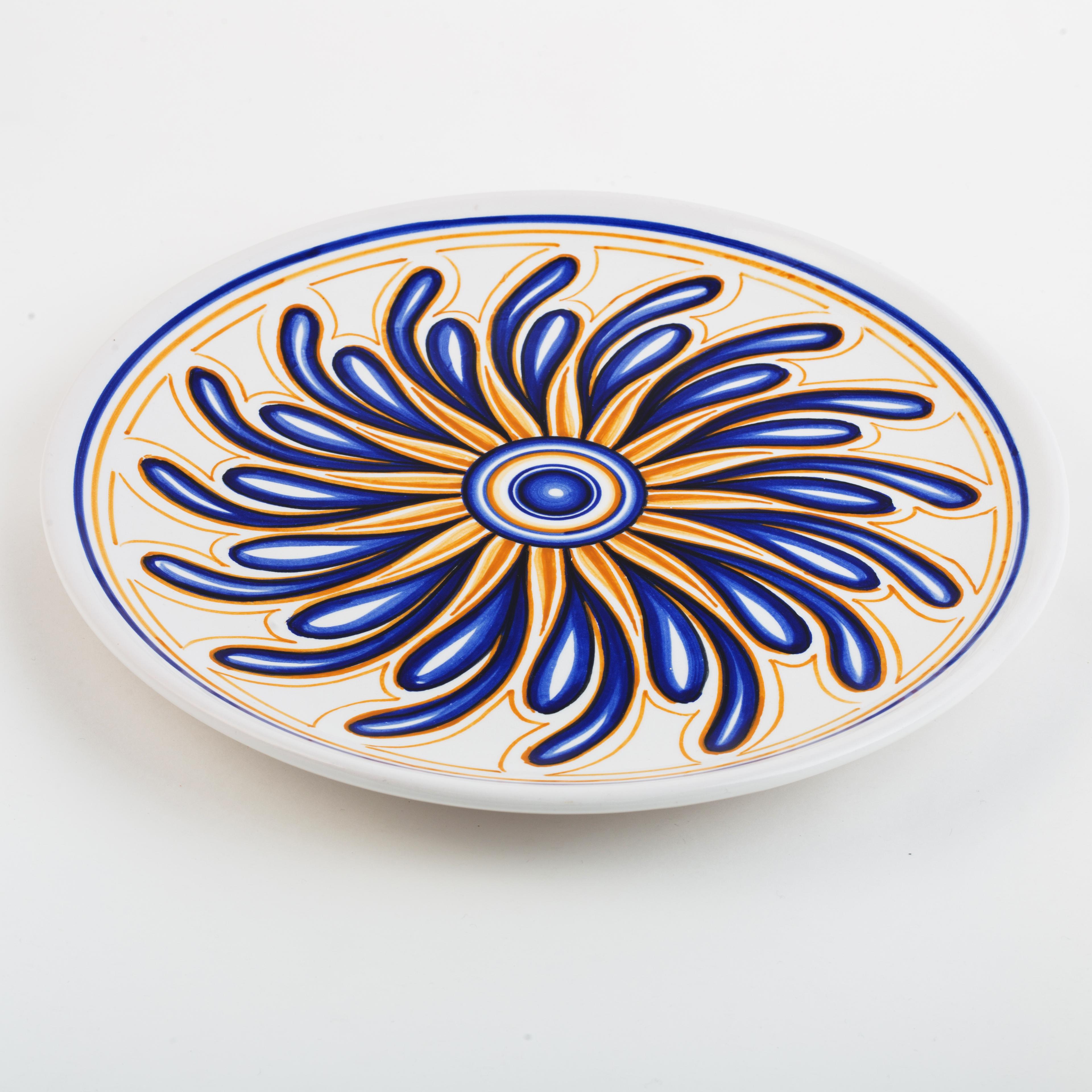 Finely hand-painted, this set of 9 decorative red clay plates takes inspiration from the Sicilian legend of 