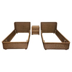 Set of two single beds with 80s rattan bedside table