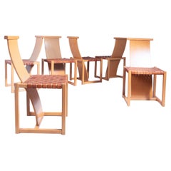 Set of six wood and leather dining chairs, 1970s
