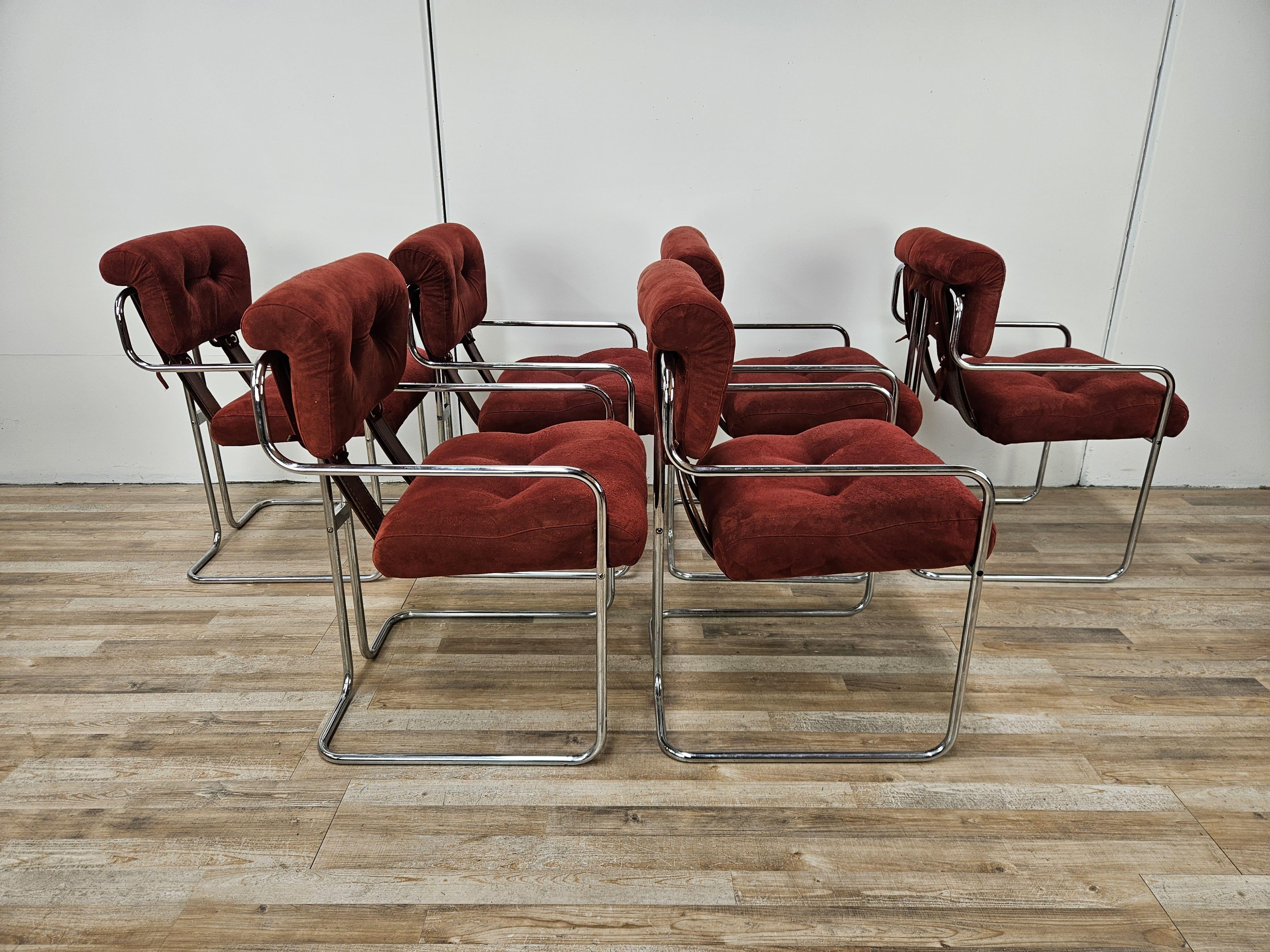 Rare set of six Tucroma model dining chairs designed by Guido Faleschini for i4 Mariani circa 1970.

The frame is tubular metal while the backs and seats are finely upholstered in a burgundy/red microfiber.

The chairs show normal signs of wear and