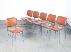 Ensemble de six chaises design italiennes des années 1960, en métal chromé et skaï