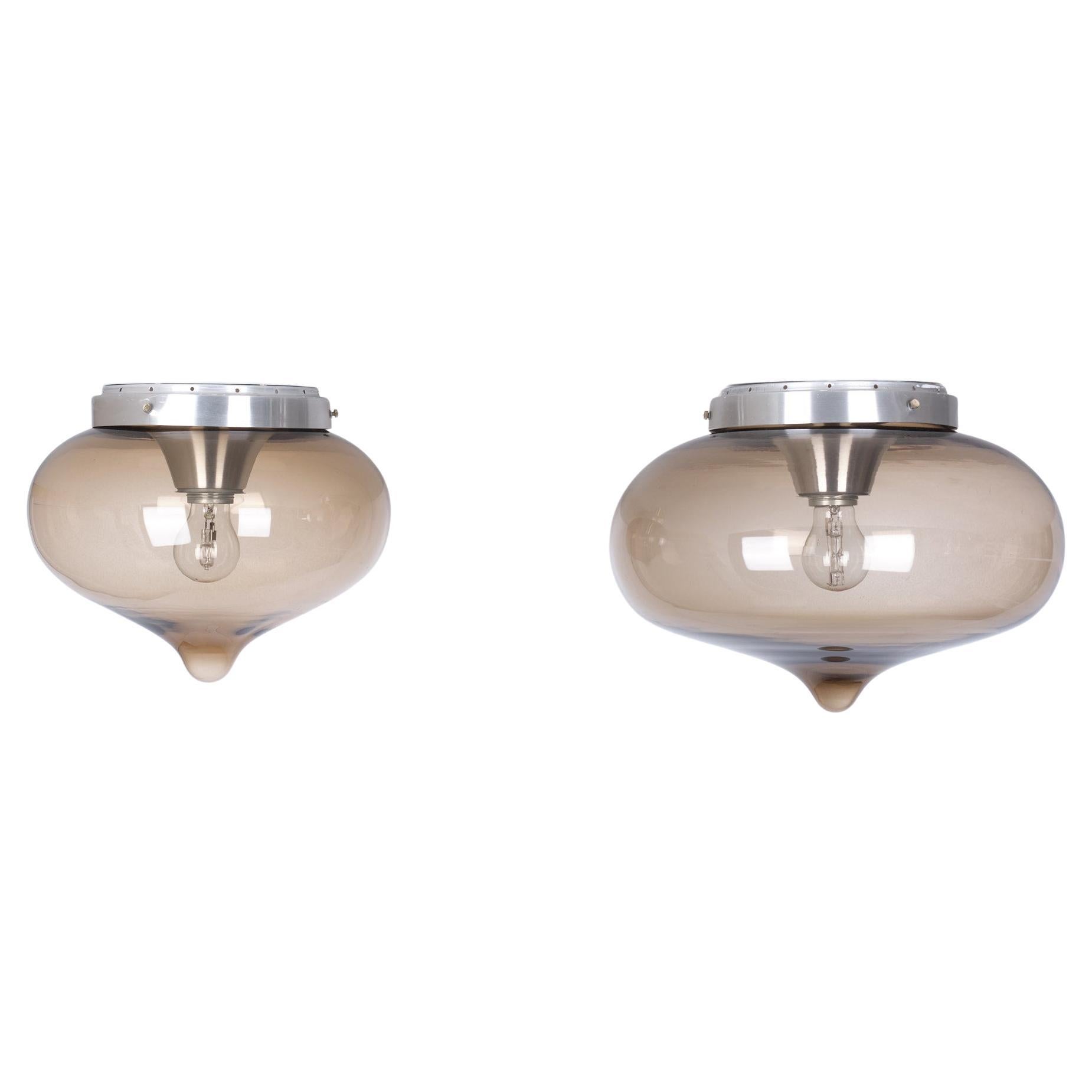 Very nice set of ceiling or wall lamps. Aluminum fixture. One large E27 
bulb. Smoked glass dome. Two sizes large one diameter 35 cm 
Small one 28 cm Holland 1970s.