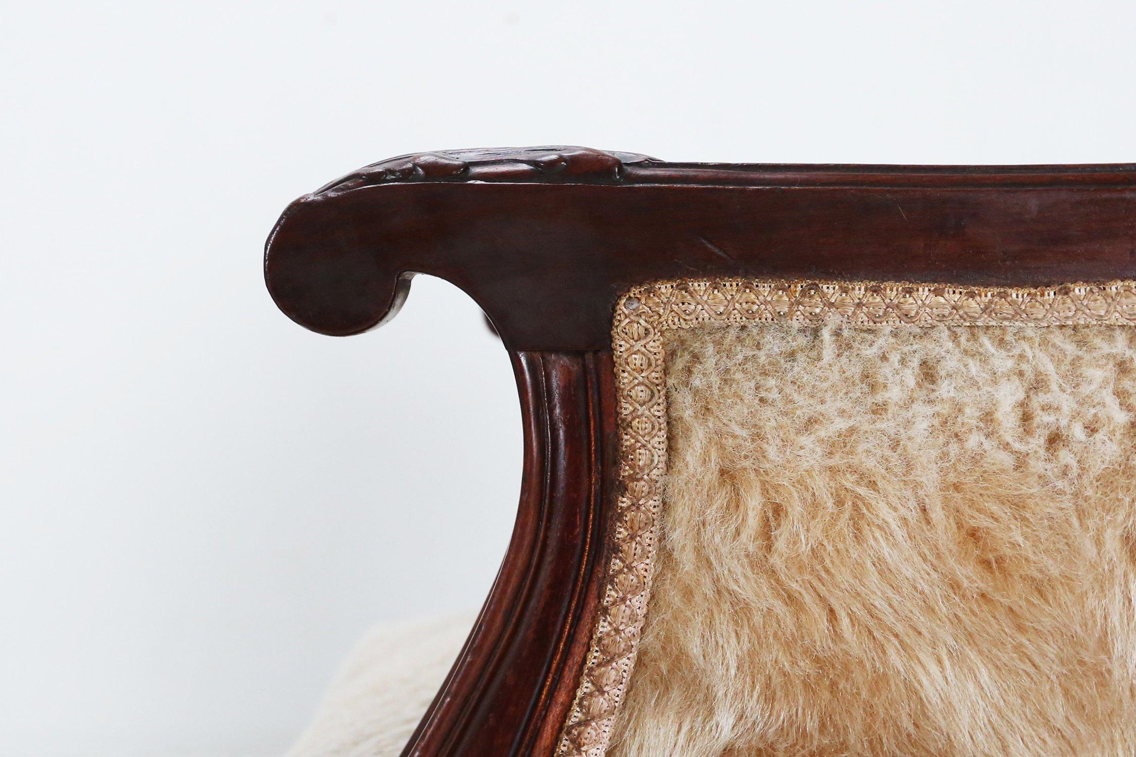 France / 1820 / 2 armchairs / mahogany, sheep skin / Romantic / Antique / Empire

Set of two early Empire armchairs constructed of solid mahogany wood and with sheepskin upholstery. Handcrafted around 1820 in France. This set of armchairs have hand