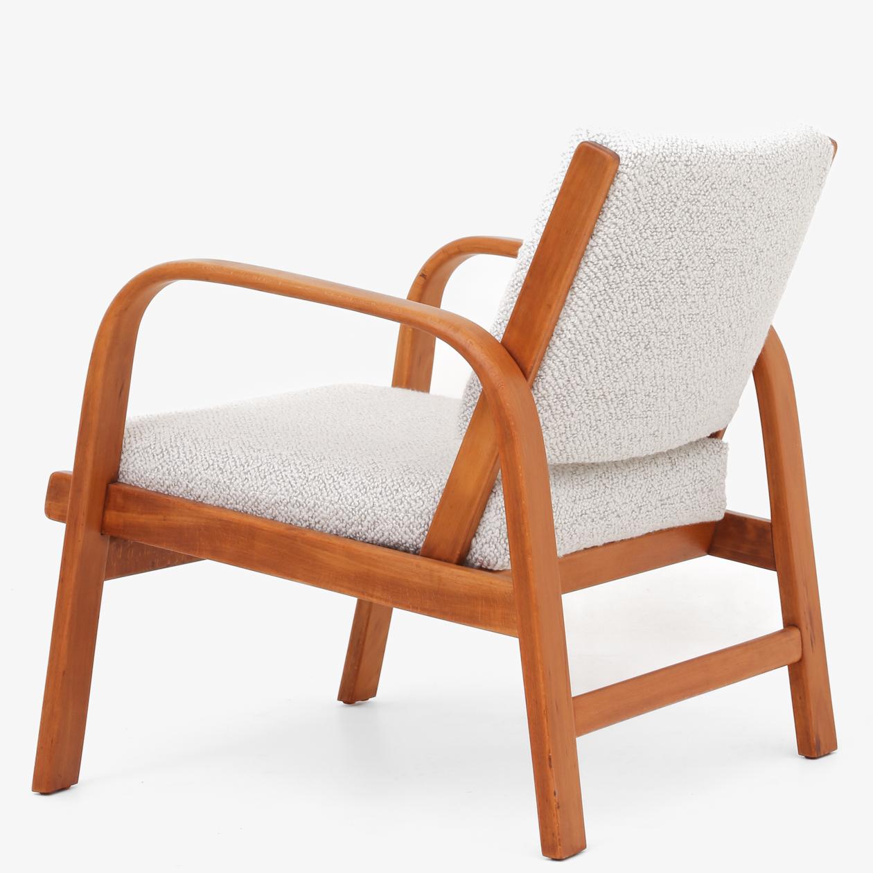 A set of easy chairs in patinated beech, reupholstered in textile (Bridget Meringue, colour 001). Designed in 1932. Magnus Stephensen / Fritz Hansen.