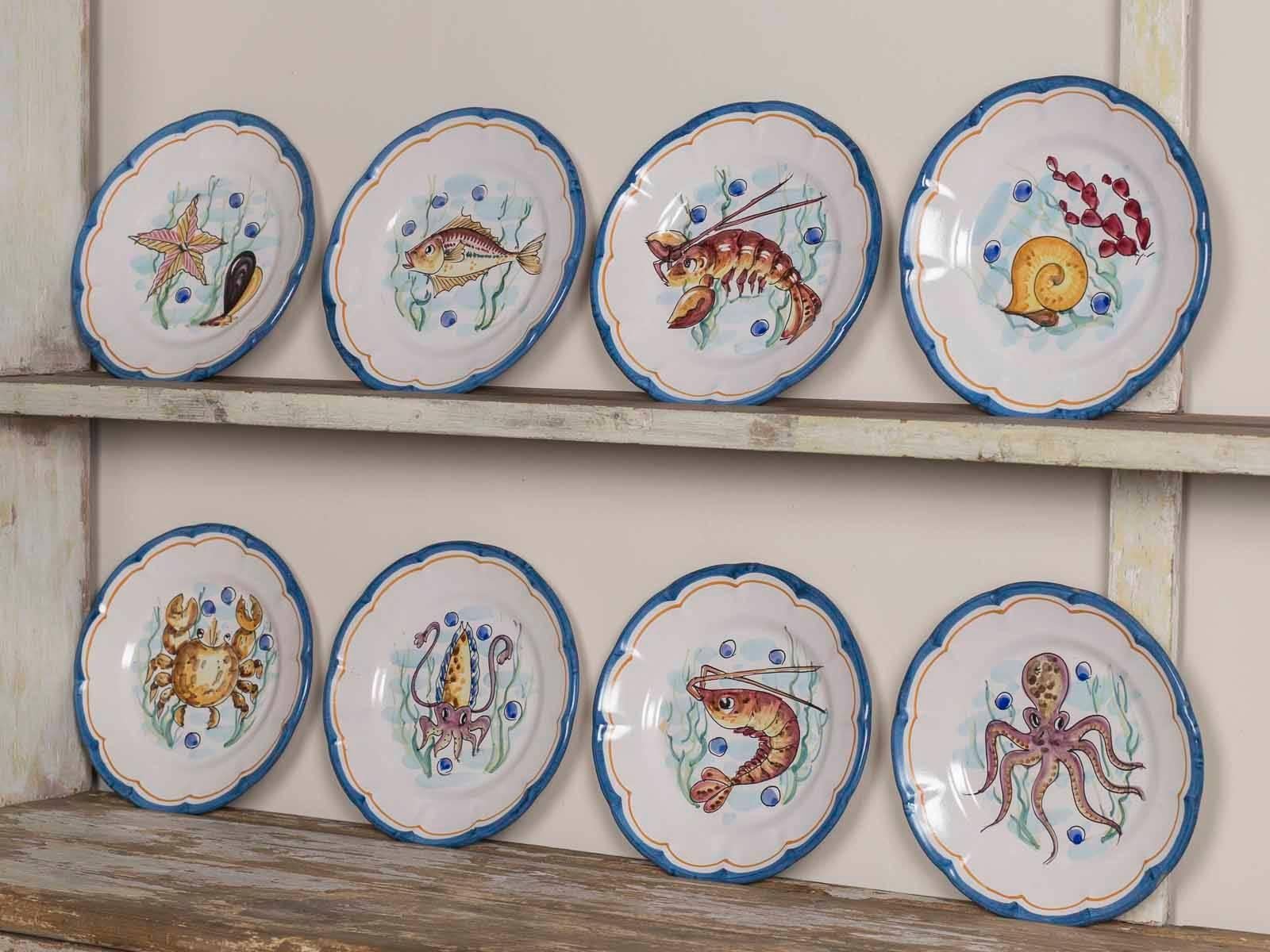 Amazing images, hand-painted charm, Italian artistry are the featured elements of this unique set of eight dinner plates from Vietri, Italy along the Amalfi Coast. We love the scalloped profile of these plates along with the choice colours chosen by