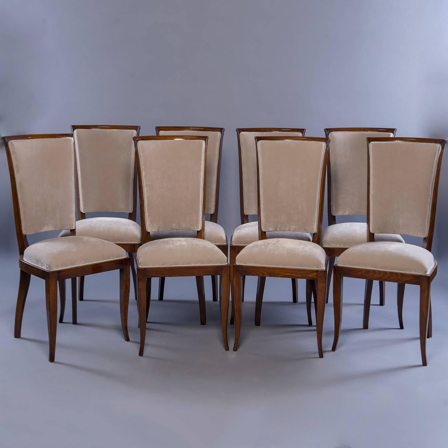 Set of eight Italian dining chairs with polished walnut frames and new sand colored velvet upholstery on seats and backs, circa 1960s. Seats are 19.5” high and 14.5” deep. Sold and priced as a set of eight.
 