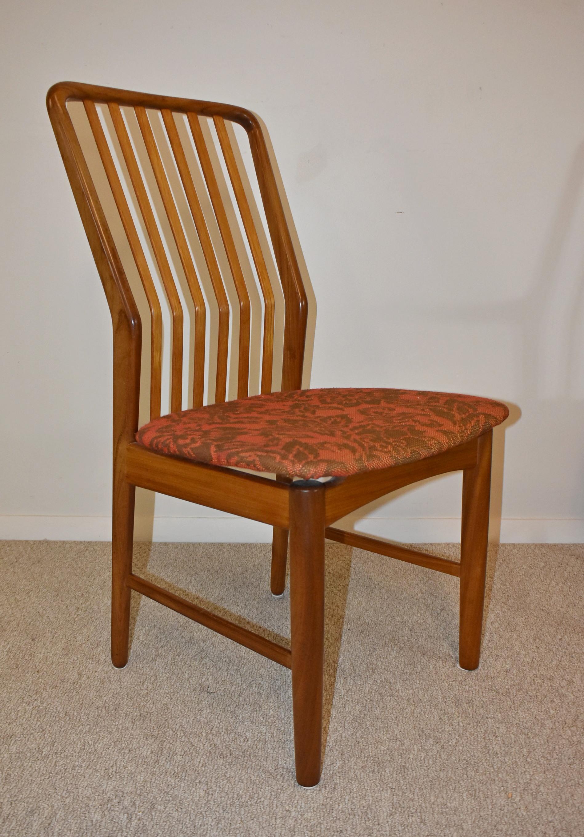 Eight teak Danish dining chairs by Svend Madsen for Moreddi. Removeable floating seats. Very nice condition circa 1960's. Arm chair measures 24' wide x 23