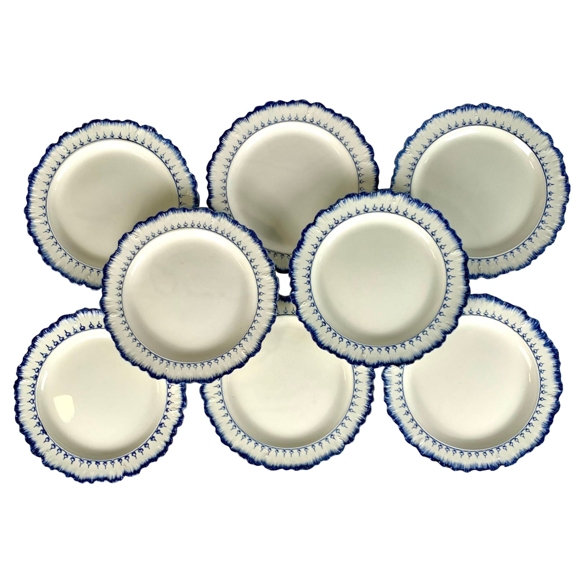 This set of eight blue and white dinner plates is painted in Wedgwood's Mared pattern.
The pattern is characterized by a beautiful shell edge and a loop of 