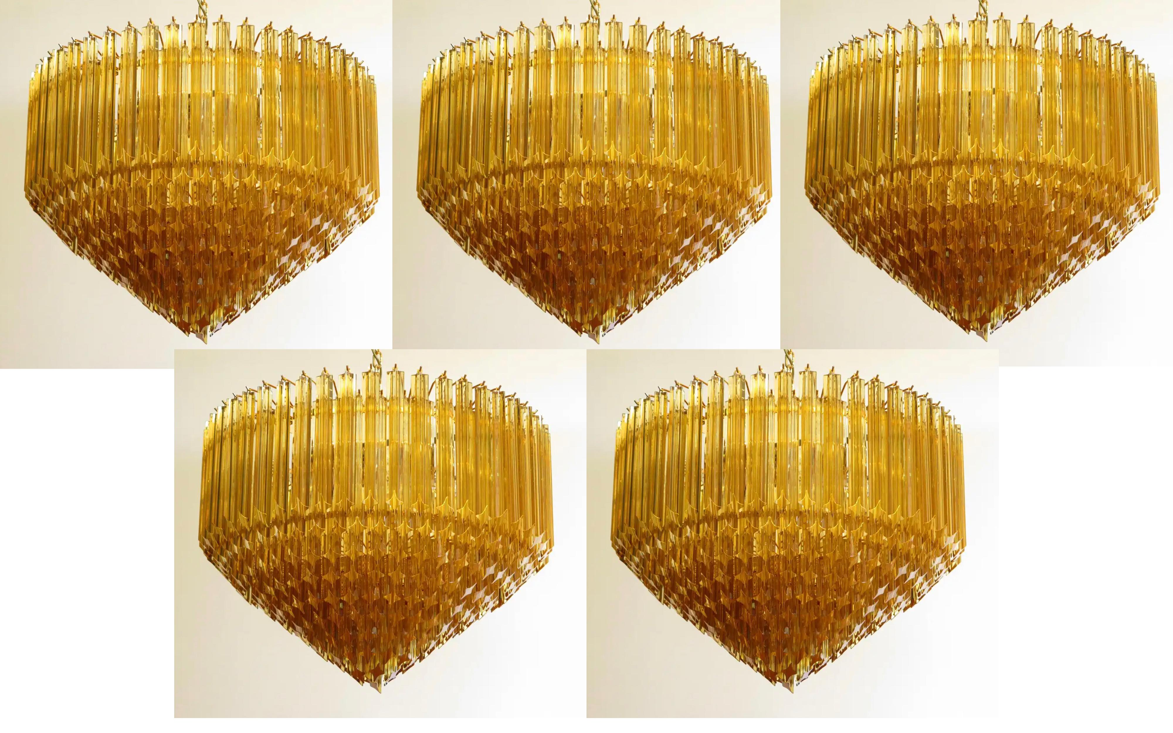 A magnificent Murano glass chandelier, 265 amber quadriedri on gold frame. This large midcentury Italian chandelier is truly a timeless classic. New product, prompt delivery.
Dimensions: 57.10 inches (145 cm) height with chain; 25.60 inches (65 cm)