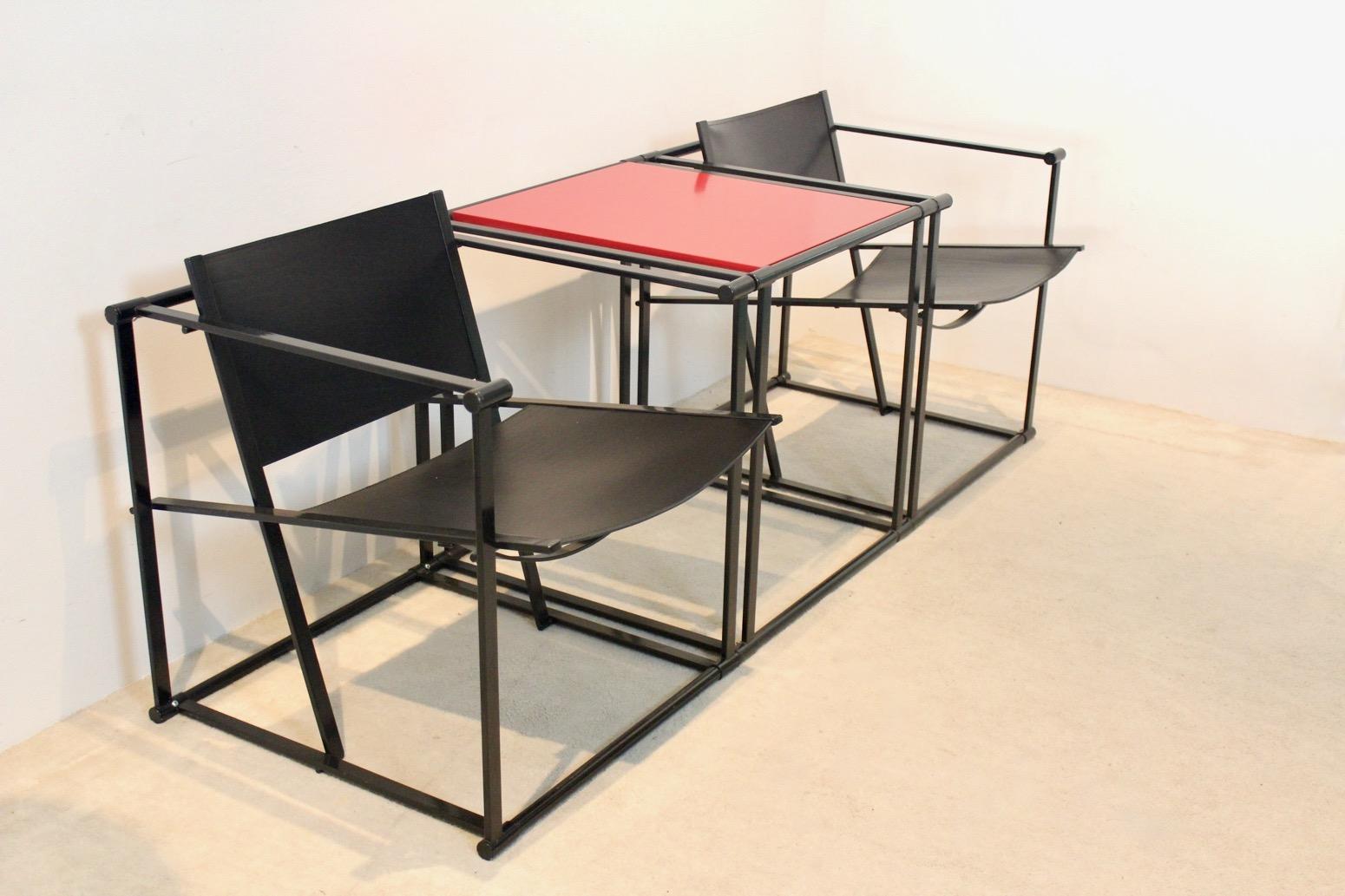 Characteristic set of two FM62 Cubic chairs designed by Radboud van Beekum for Pastoe the Netherlands in the 1980s. The Chairs come with a black lacquered square metal frame with the back and seat in strong black Saddle Leather. The Cubic Table