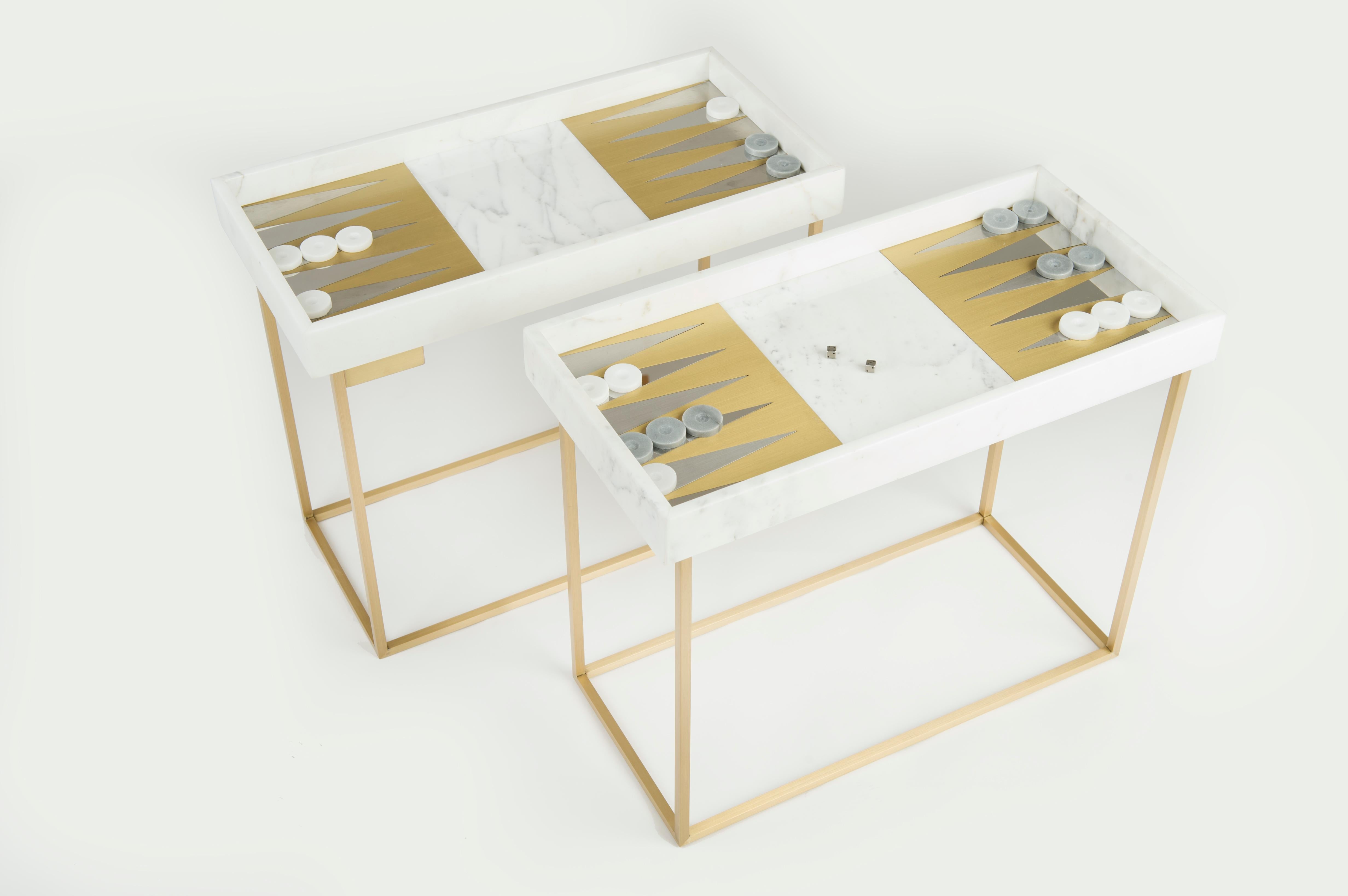 Play Backgammon table by Saccal Design House
Dimensions: L 49 x W 23 x H 45cm
Materials: Carrara and Brass
The marble in the Play Backgammon Table is Statuario marble mixed with brass and stainless steel. The playing chips are made of Carrara and