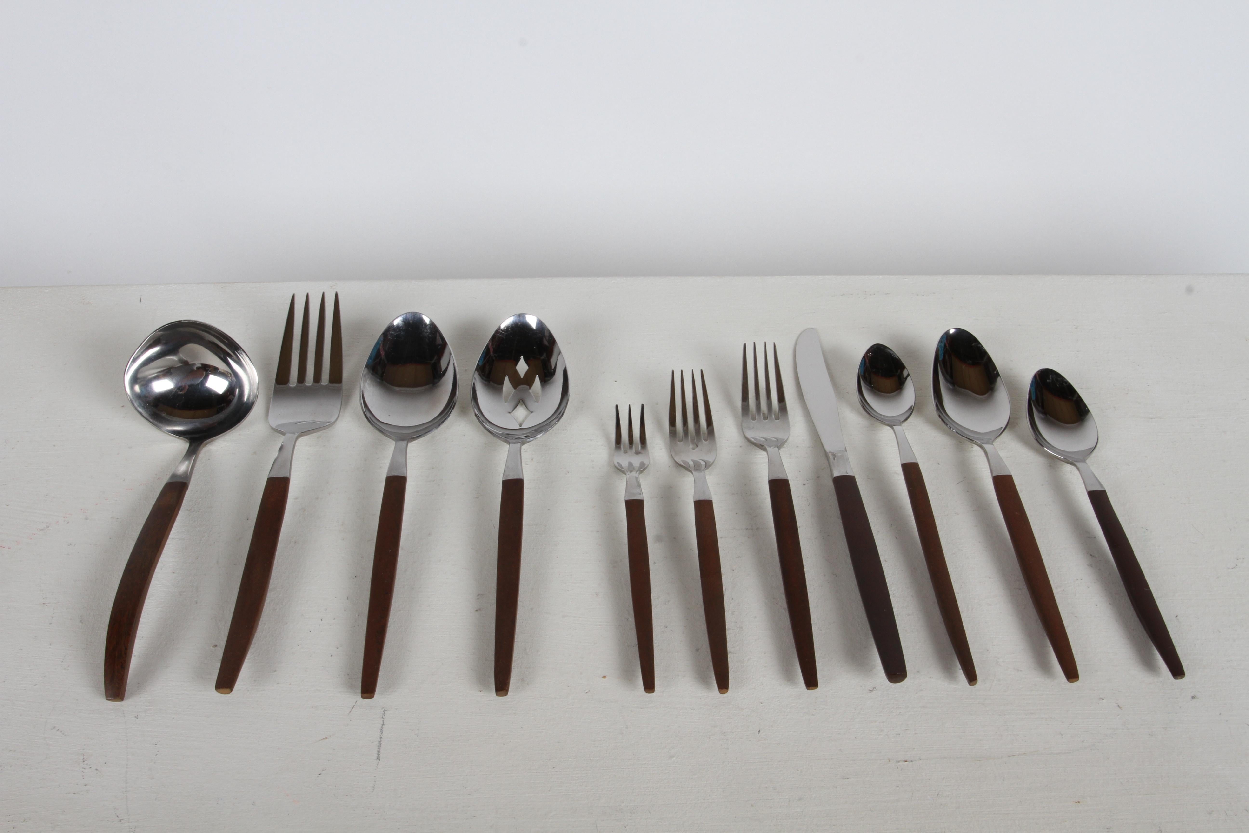 Classic Danish influenced Mid-Century sleek modernist designed stainless flatware / silverware set & serving pieces designed and sold by EKCO Products International and produced in Japan, circa 1960s. This set is from the EKCO Eterna 