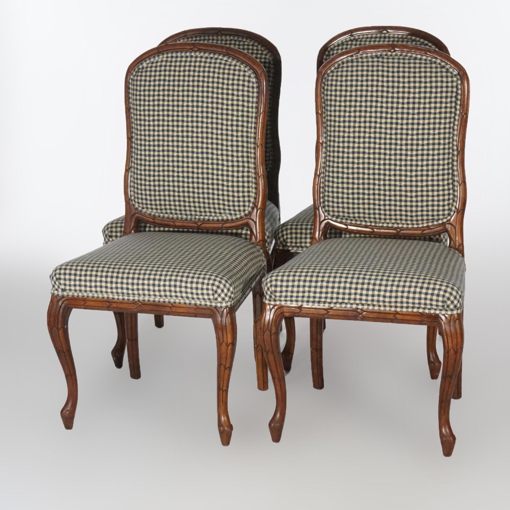 A set of four antique Continental dining chairs offer carved walnut frames with upholstered backs and seats, raised on cabriole legs, circa 1920.

Measures- 39.5''H x 20.5''W x 21.5''D.