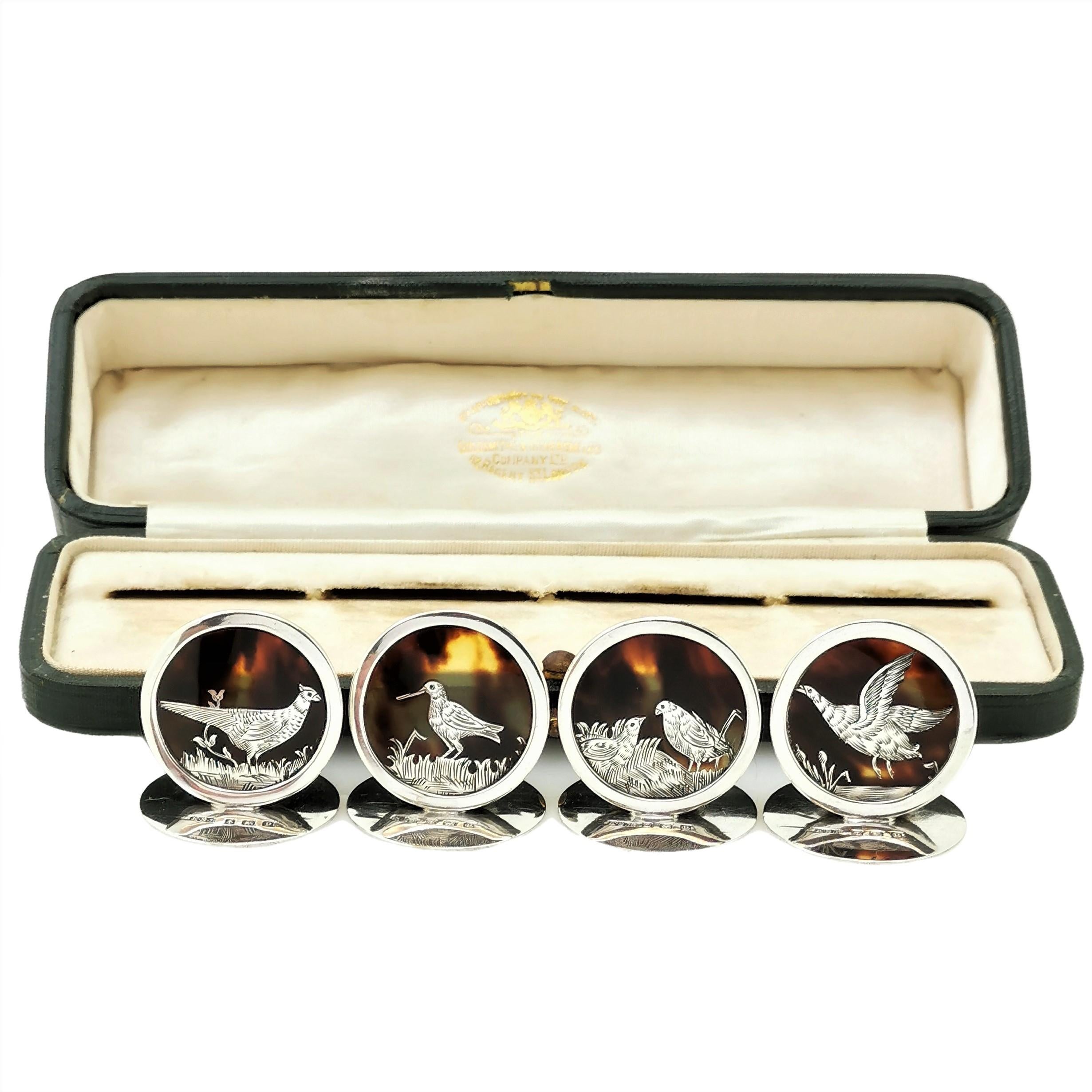 A set of beautiful antique sterling silver place card holders with circular tortoise shell panels inlaid with a unique silver game bird. These Menu Holders are presented in their original fitted case.

Made in Birmingham, England in 1914 by Edward