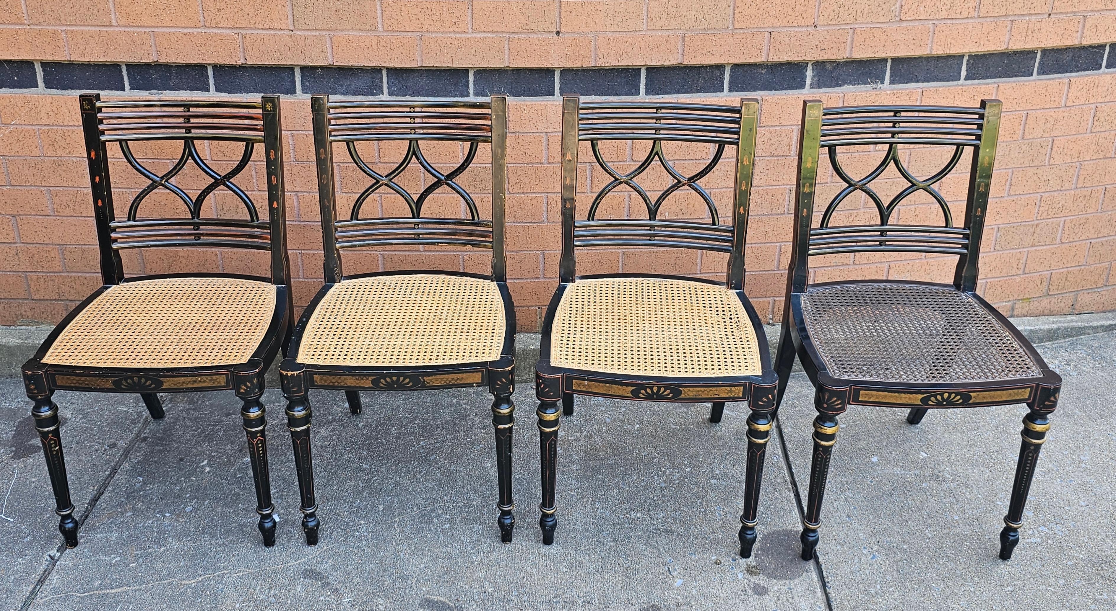 Set of Four Baker Furniture Historic Charleston Reproduction Stencil Decorated and Ebonized Wood and Cane Side Chairs.
Measures 24