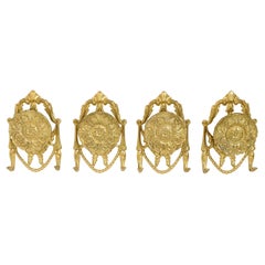 Set Four Bronze and Brass Coat Hangers