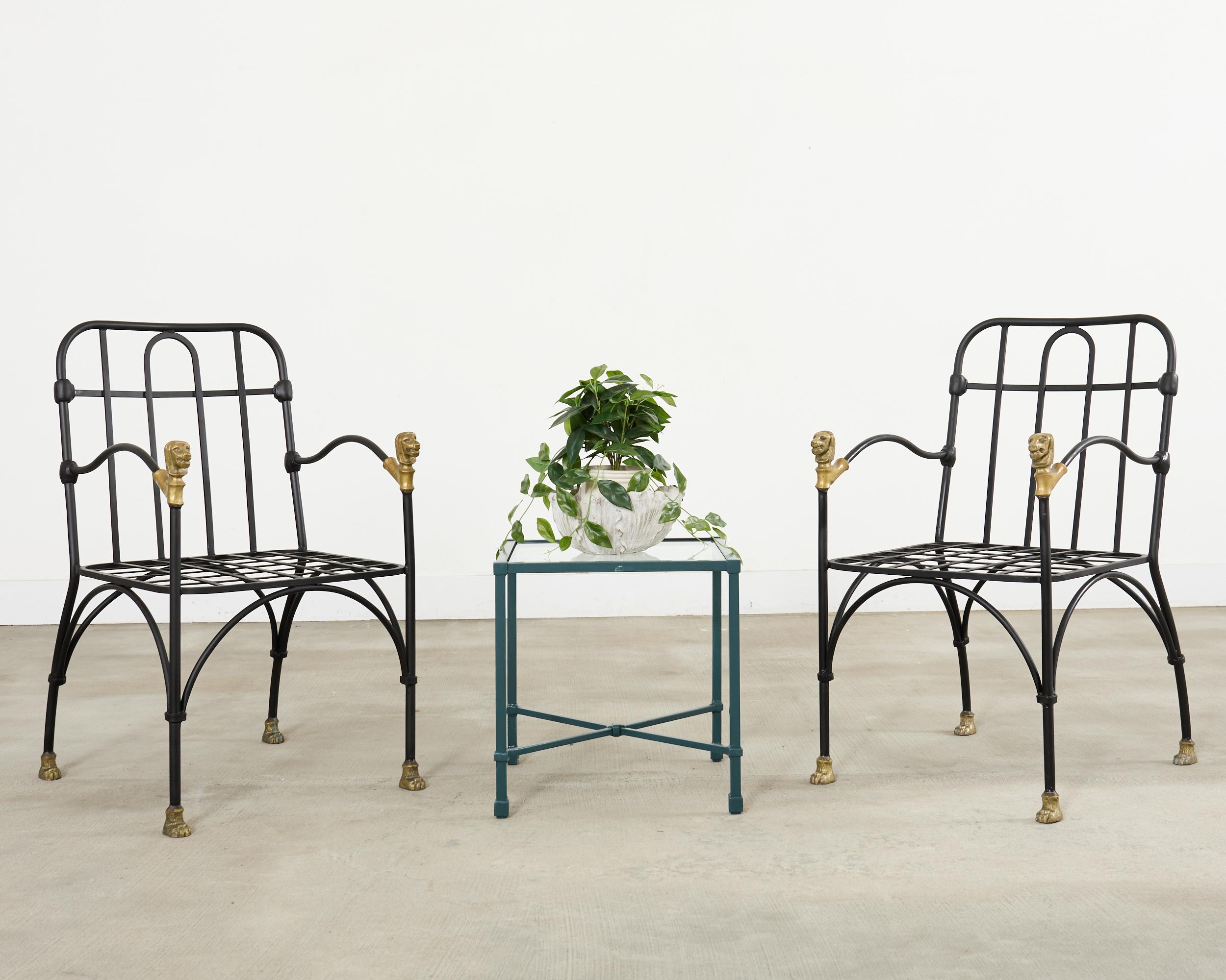 Rare and opulent set of four iron patio and garden dining chairs after Diego Giacometti. The iconic mid-century modern chairs known as 