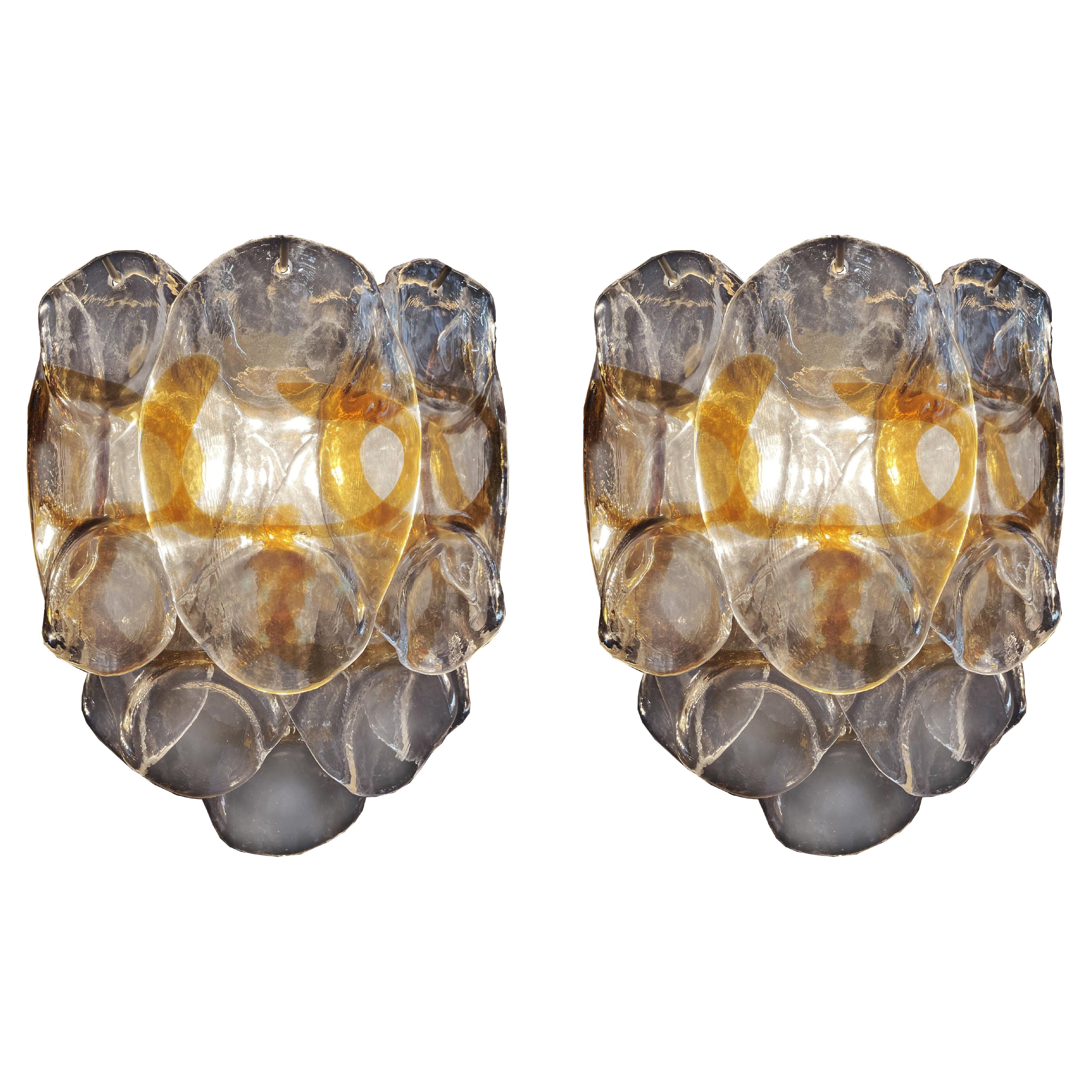 Pair of vintage Italian Murano sconcesin Vistosi style. Wall lights have 10 fantastic Murano amber and trasparent glasses (
