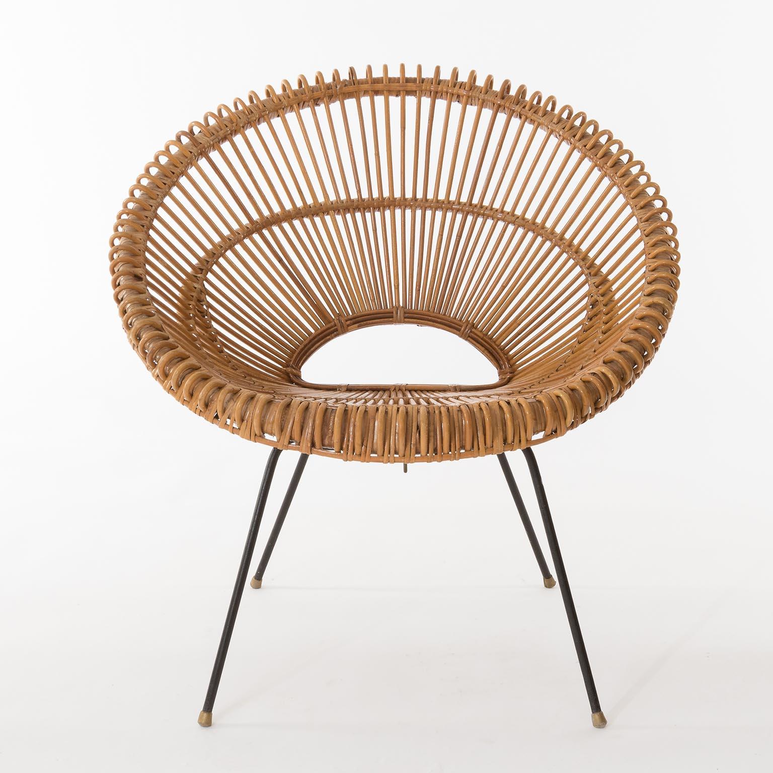 A set of four Riviera chairs made of bamboo, rattan and black metal attributed to Janine Abraham, Dirk Rol, France, circa 1960.