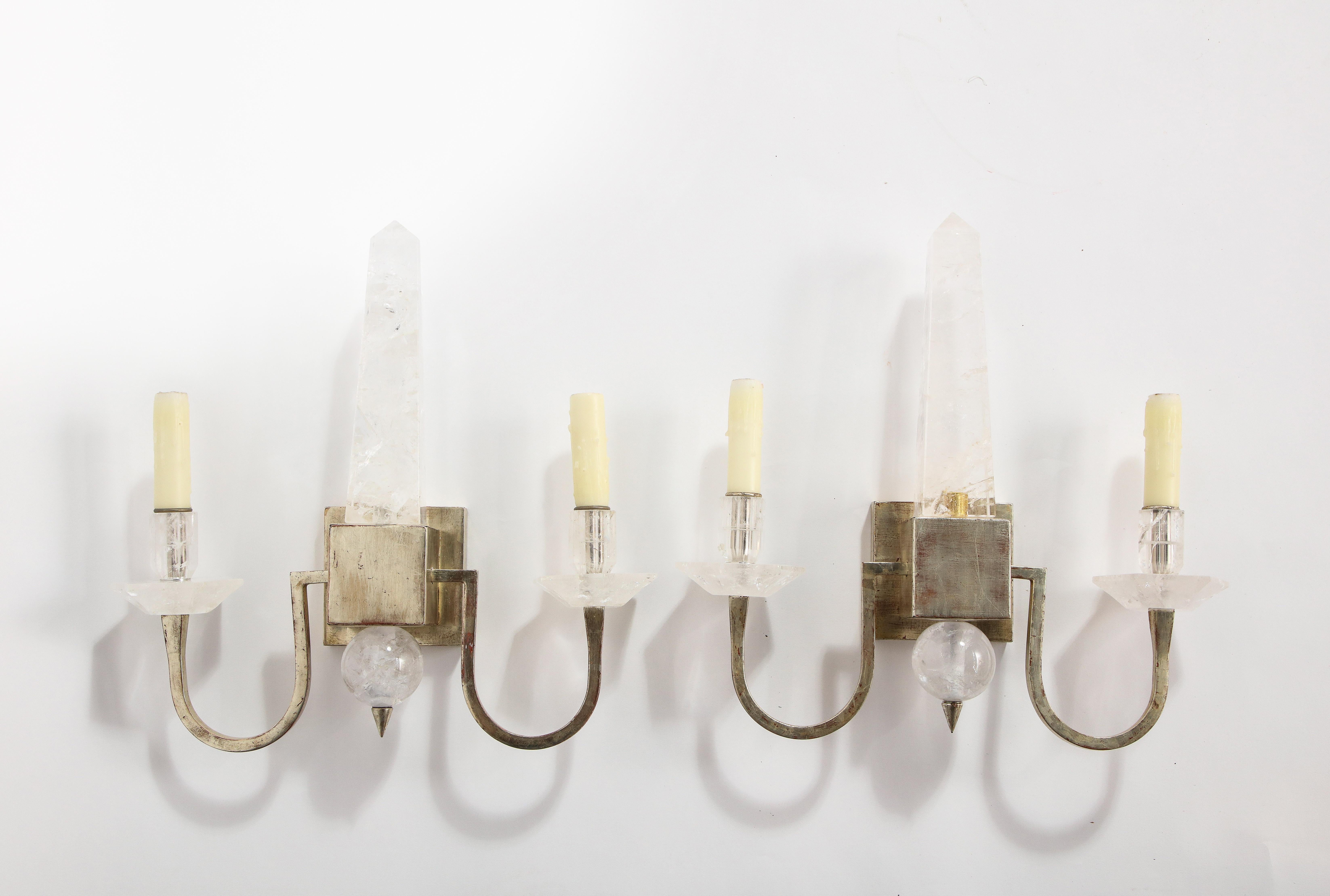 A fine set of four modern two-light rock crystal and silvered wall appliques/sconces with a hand carved center mounted rock crystal obelisk. This is a beautiful pair of modern era sconces. They have a beautiful form with two gorgeous silvered arms