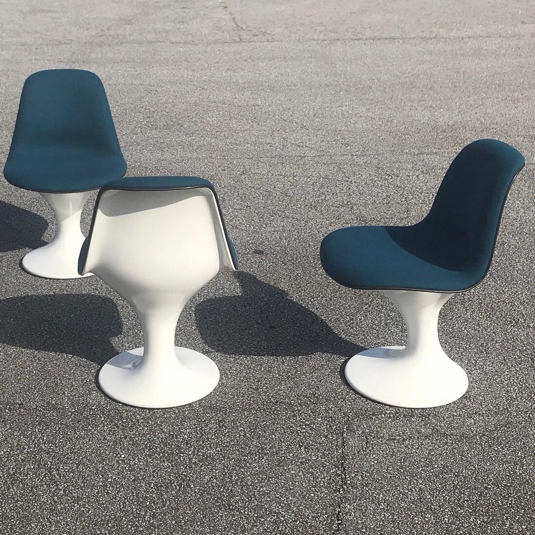 Beautiful space age orbit dining chairs by Markus Farner and Walter Grunder for Herman Miller, 1960s.

All chairs are fully refurbished with new soft white coat to the glassfiber and Danish petrol blue wool upholstery. All made by our professional