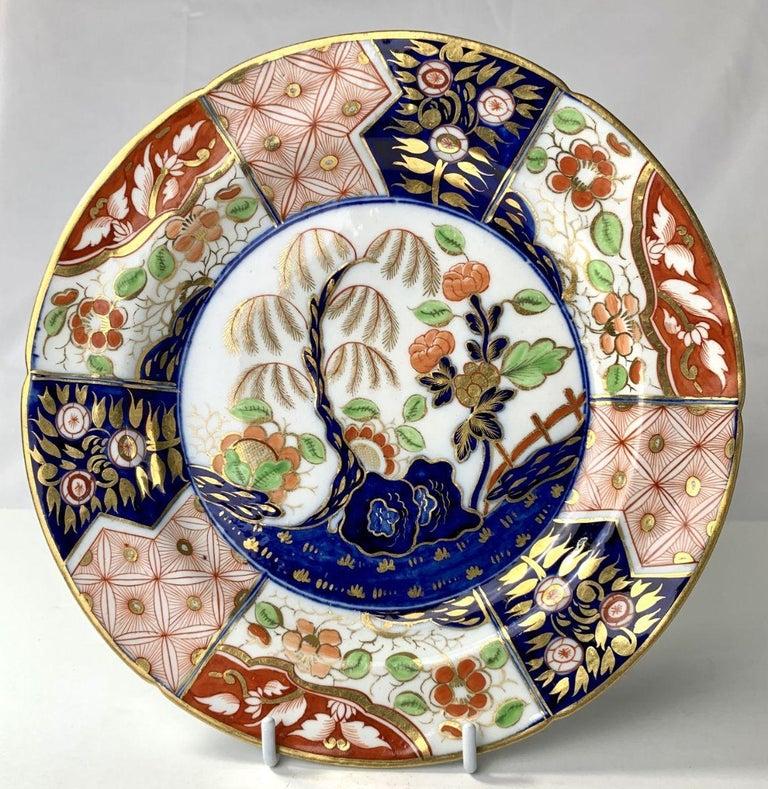 We proudly offer this set of fourteen Coalport Money Tree pattern plates. 
This fabulous pattern is also known as the Rock and Tree pattern. It is one of the very best of the Regency period porcelain patterns. 
The color combinations are