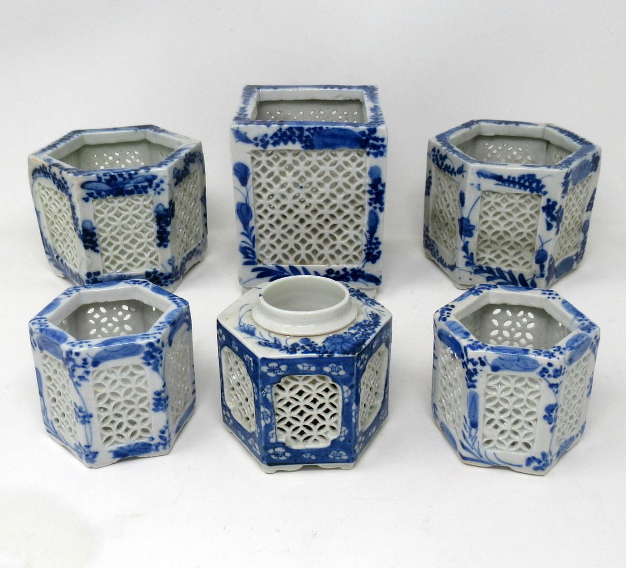 Stylish assembled set of six hand painted Chinese or Japanese Export reticulated or lattice pierced blue and white porcelain vases of hexagonal and square outline, circa first half of the 20th century. 

Each finely hand decorated on all outer