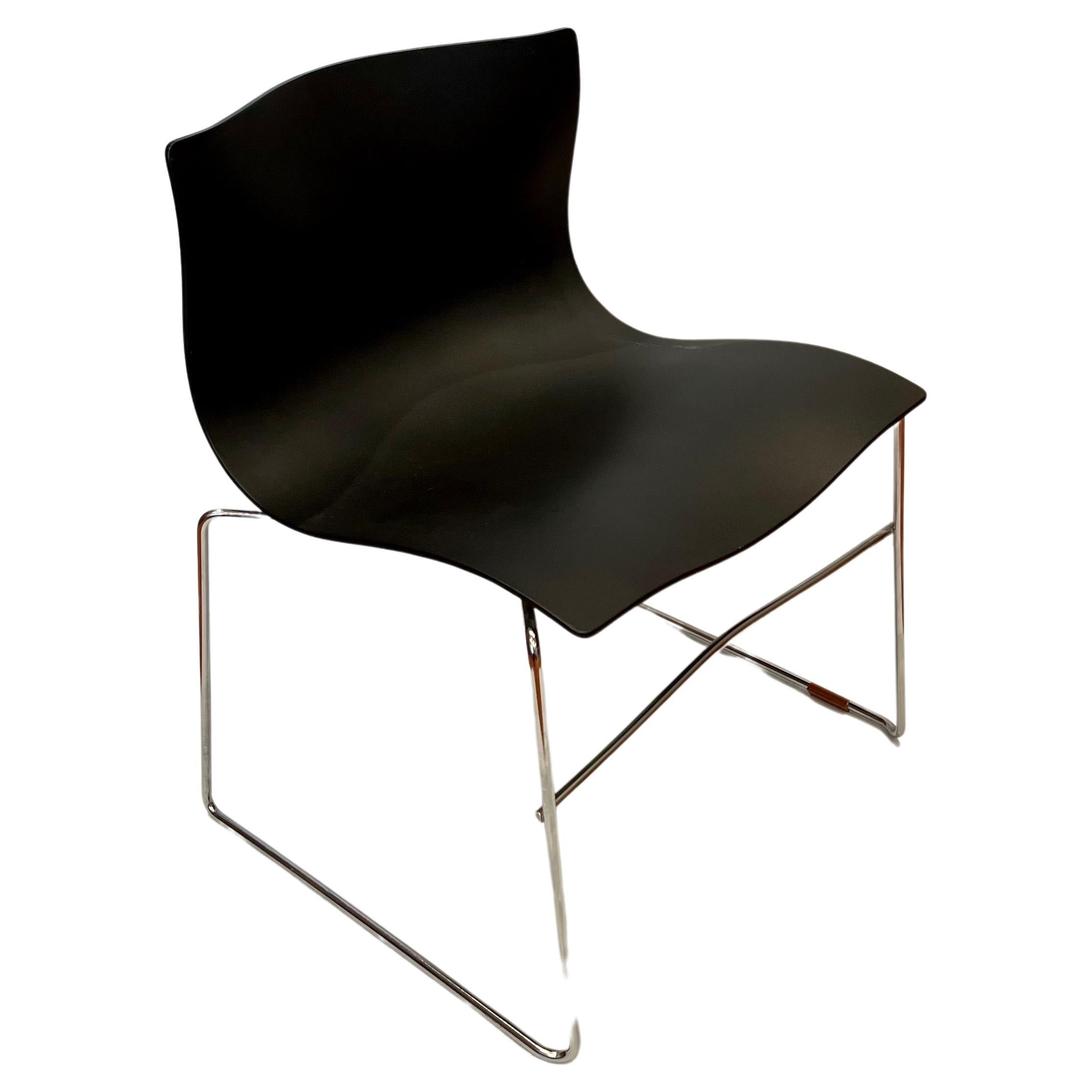 A great set of 4 chairs designed by Massimo Vignelli for Knoll, circa 1983, for Knoll studio great condition complete with rubbers chrome has been polished, the seats are very clean these chairs are nice and comfy. These chairs are stackable for