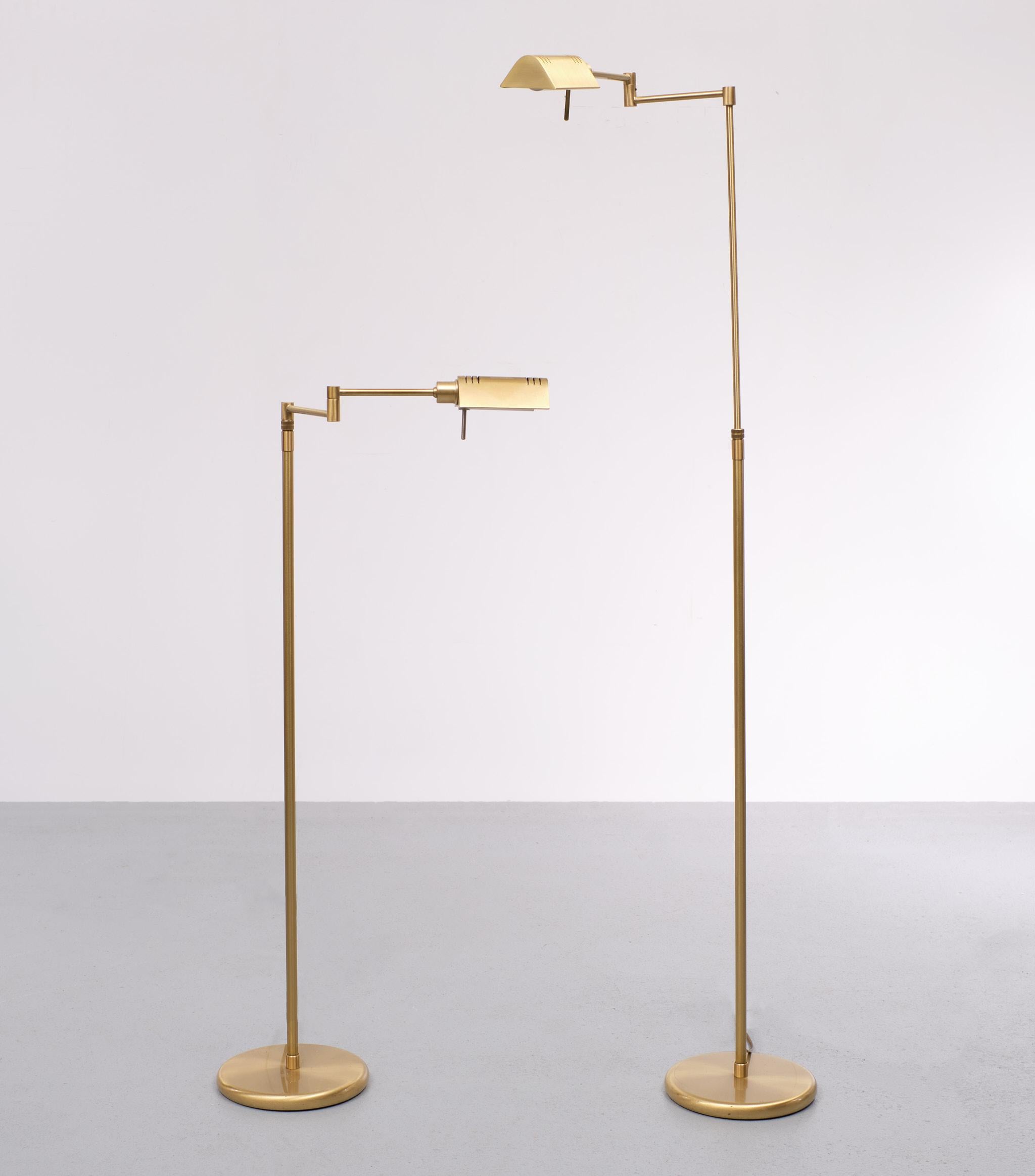 Two identical Holtkötter, Swing arm floor lamps. Brass. Halogen with good working 
dimmers. Adjustable in hight. 100 cm to 147 cm very nice quality and condition.