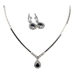 Set in 18 carat white gold composed of a necklace and pendant earrings Set in 18 carat white gold composed of a necklace and pendant earrings