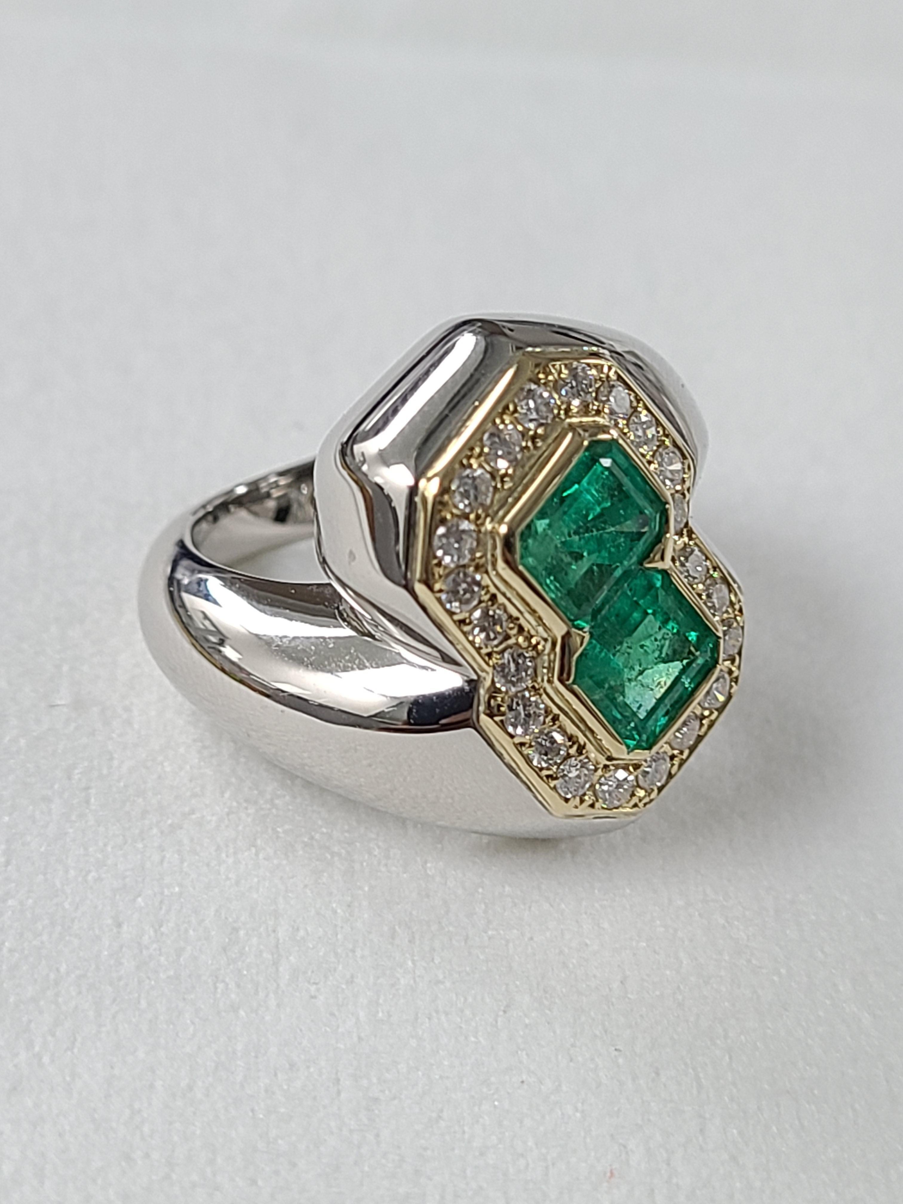 A Gorgeous Estate ring with natural emeralds and diamonds set in a mix of Platinum PT900 and 18K gold . The emerald weight is 1.86 carats and diamond weight is .39 carats . Ring dimensions in cm 1.8 x 1.8 x 2.3 (L X W X H). US size 5 1/2