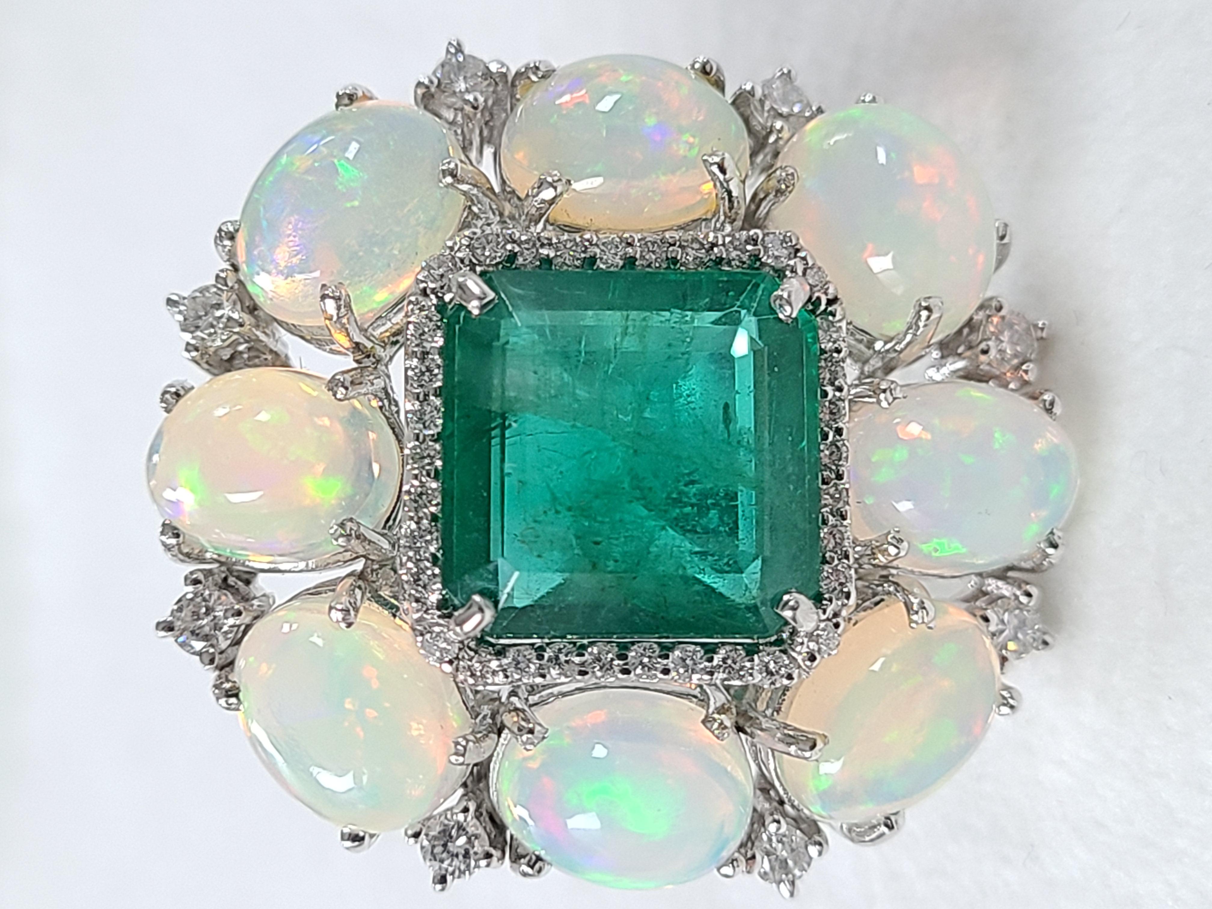 A gorgeous and very chic Ethiopian Opal & Zambian Emerald Cocktail Ring set in 18K White Gold and Diamonds. The Opals are completely natural, without any treatment, originating from Ethiopia and weighs, 8.40 carats. The Emerald is also completely