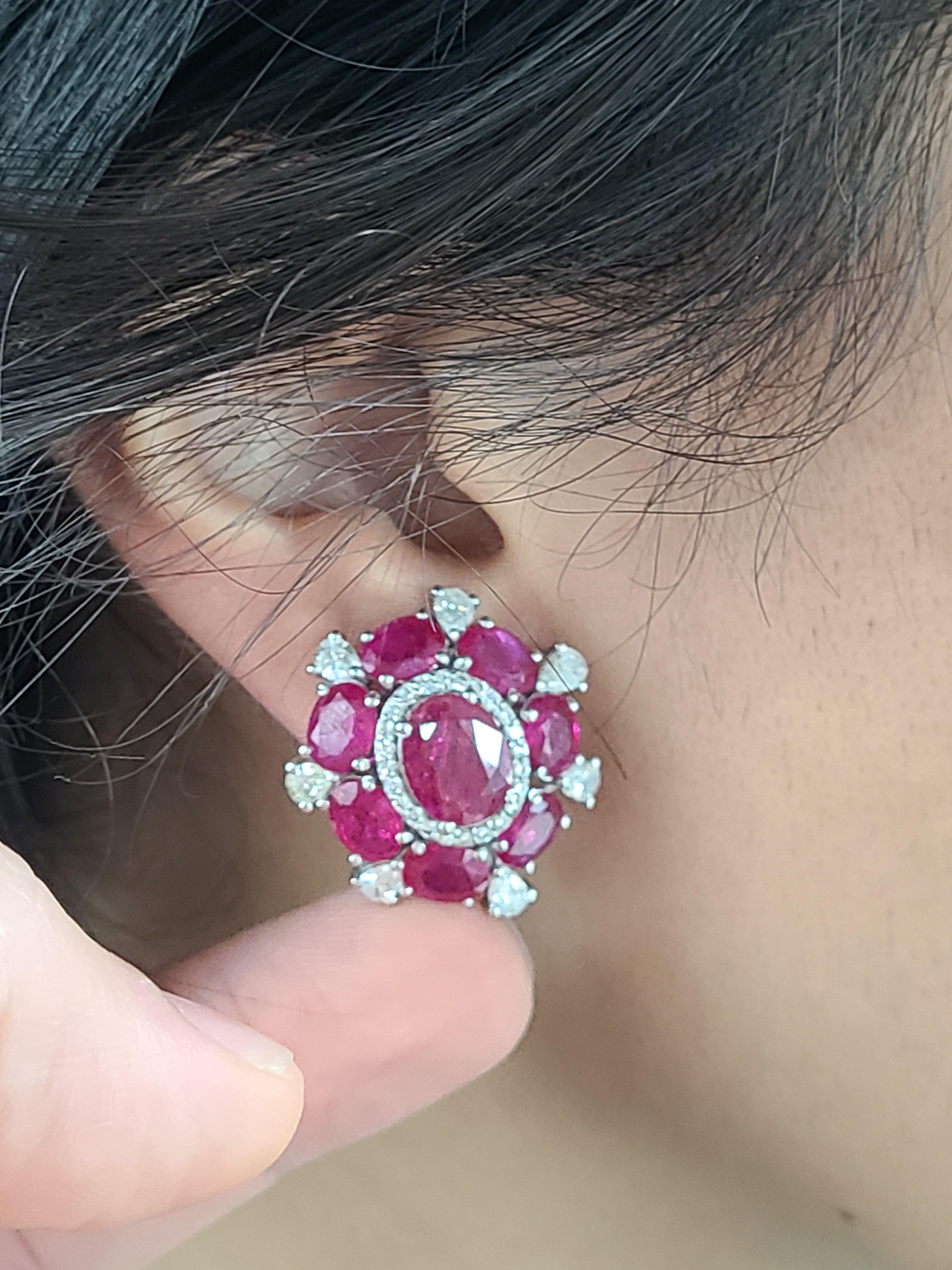 A very gorgeous pair of Ruby and Diamond Studs set in 18K White gold. The Rubies are of Mozambique origin and completely natural, without any treatment. The weight of the Rubies is 13.21 carats. The weight of the Diamonds is 1.95 carats. The