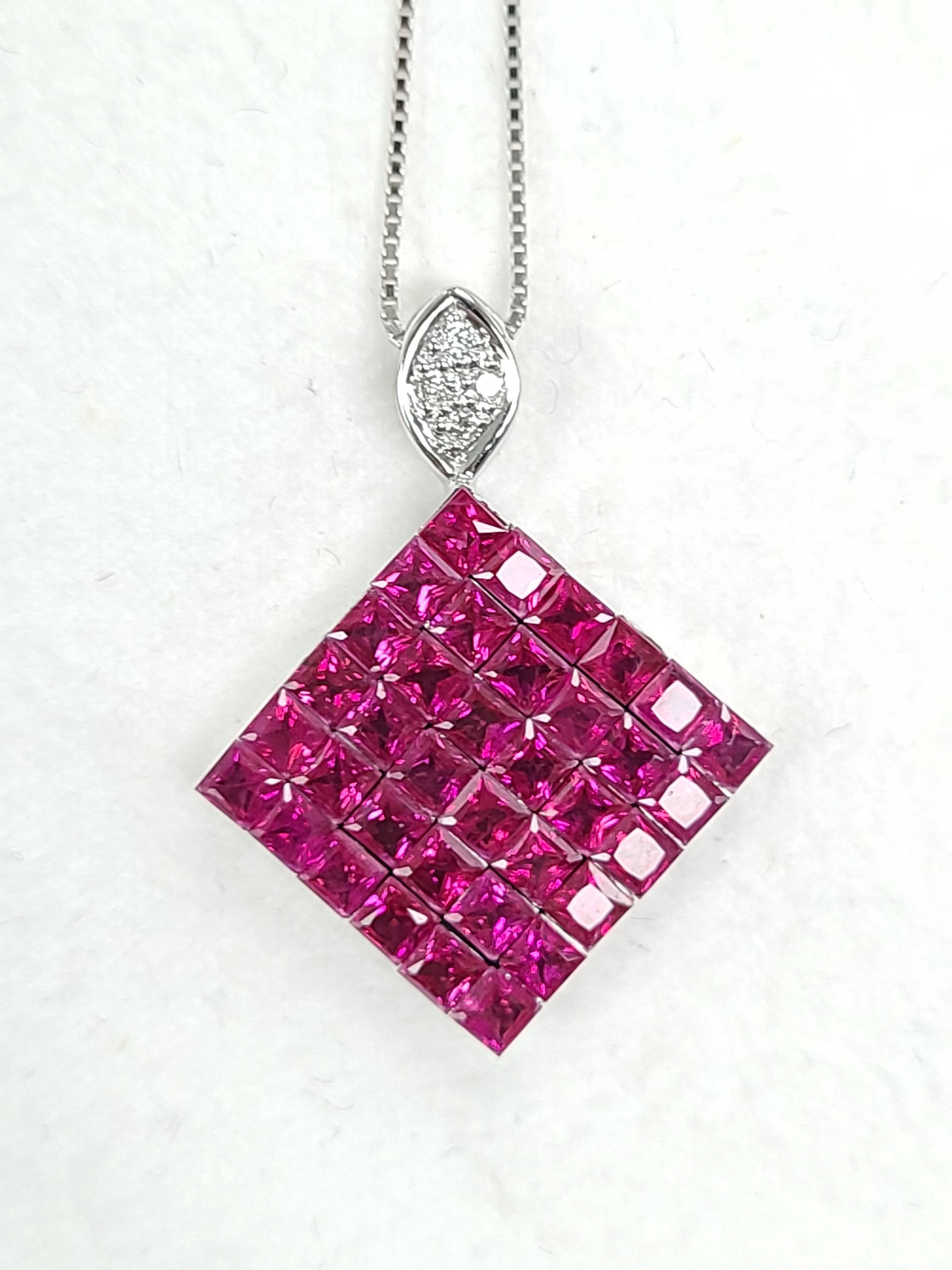 A gorgeous invisible setting ruby pendant with diamond made in 18k white gold . The approximate length of chain with pendant is 22.5 cm . The chain has an efficient and easy mechanism of making the chain length longer and shorter at ease. The