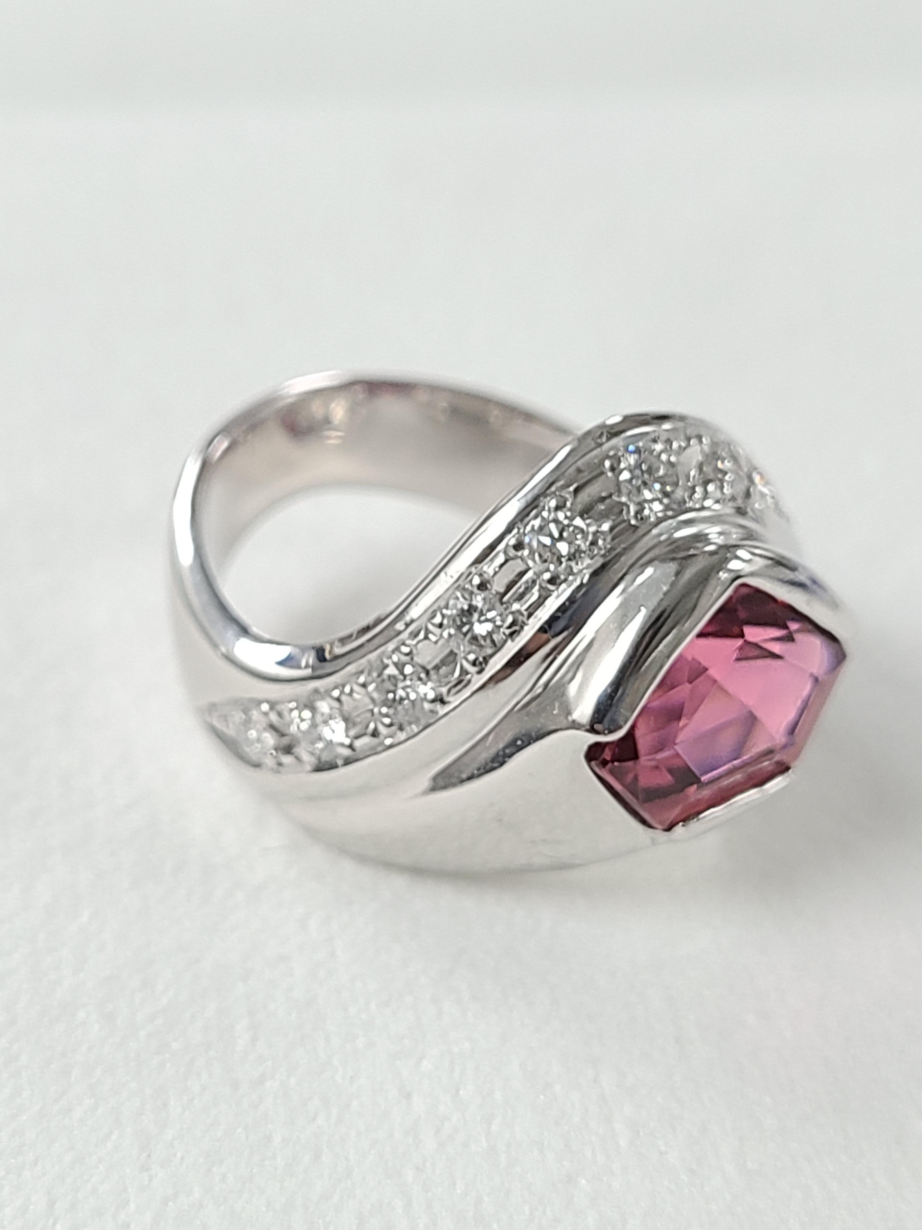 A beautifully designed ring with tourmaline and diamond set in 18k white gold ! it much more pretty then it looks in the photo ! Tourmaline weight is 2.55 carats and diamond weight is .416 carats ! Ring dimensions in cm 1.4 x 2 x 2.2 ( L X W X H ) .