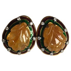 Set in 18 Karat Yellow Gold, Carved Sapphire and Enamel Studs with Diamonds Set in 18 Karat Yellow Gold, Carved Sapphire and Enamel Studs with Diamonds