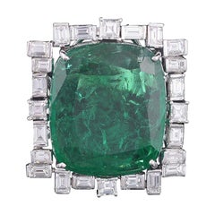 Set in 18K, 30.88 cts, natural Zambian Emerald 
Baguette diamonds cocktail Ring