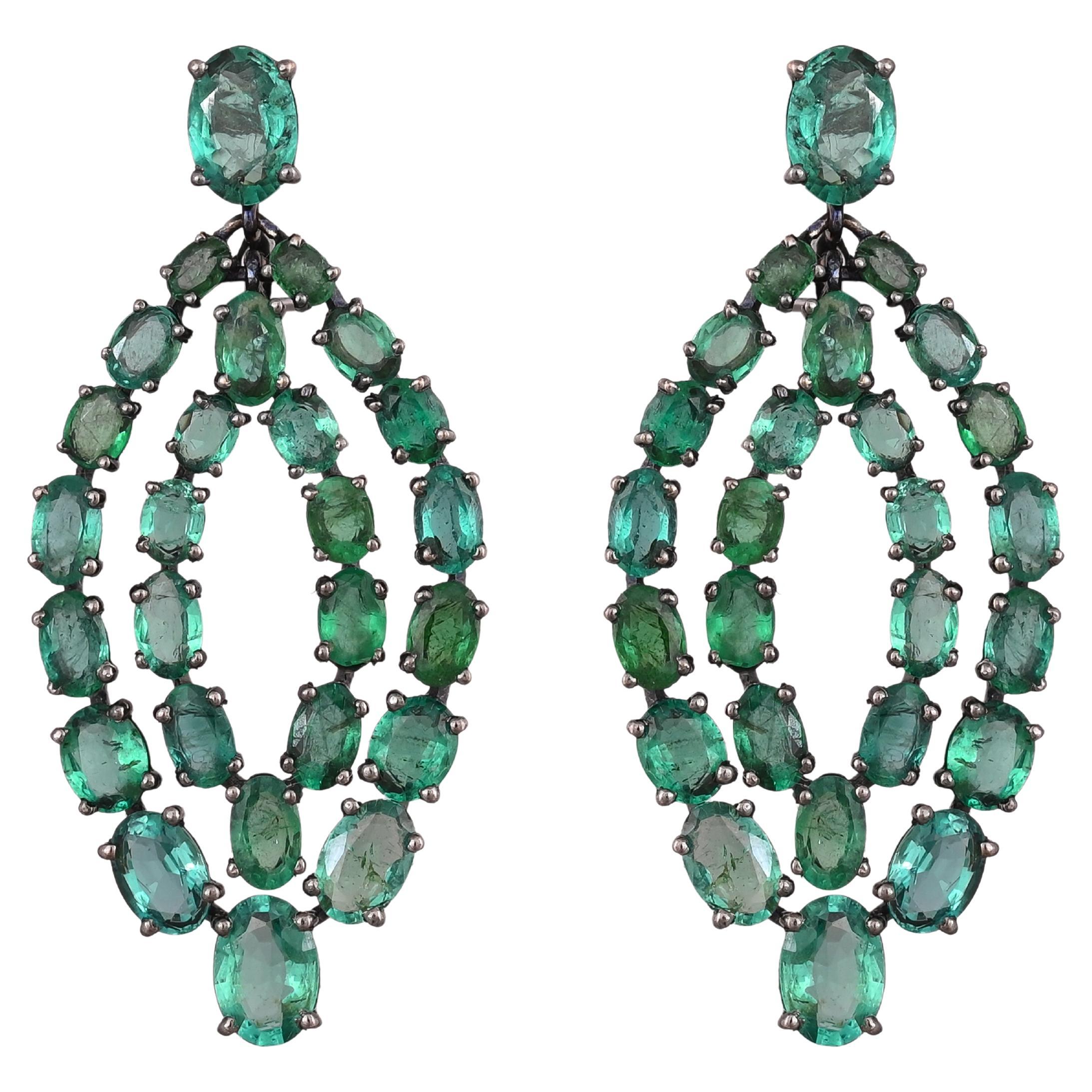 A very gorgeous and beautiful, Art Deco style Emerald Dangle Earrings set in 18K Blackened Gold. The weight of the Emeralds is 12.74 carats. The Emeralds are completely natural, without any treatment and is of Zambian origin. Net Gold weight is