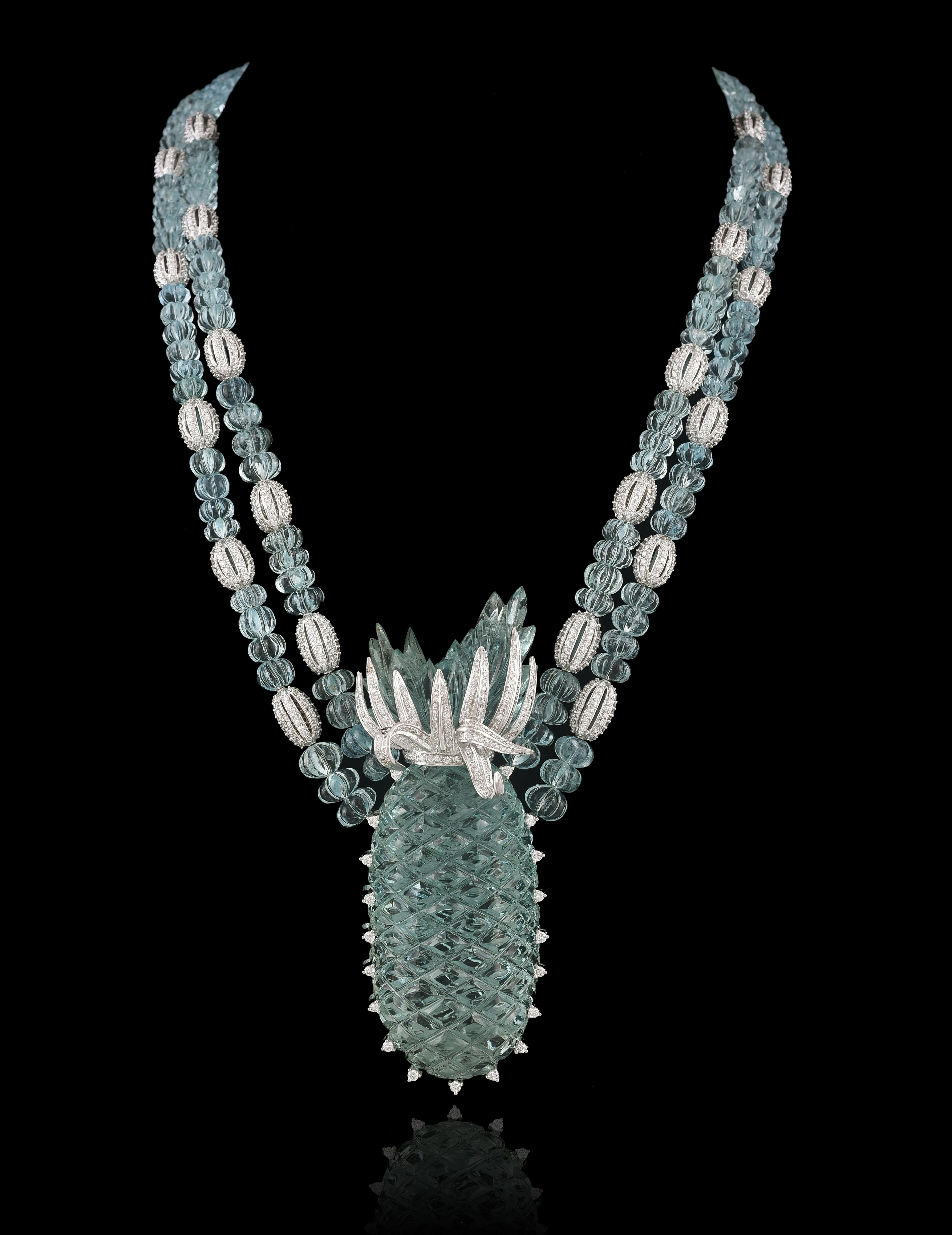 A one of the kind, hand - carved, Aquamarine beads and Pineapple carved Multi Strand Pendant Necklace set in 18K White Gold and Diamonds. All the Aquamarine is natural, hand - carved in our very own workshop and therefore guaranteeing authencity of
