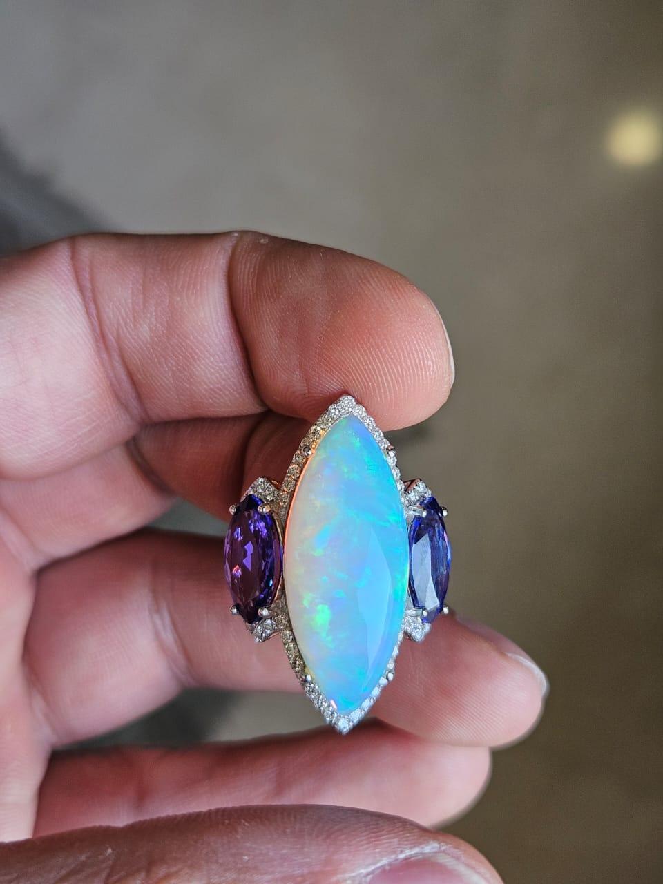 A very gorgeous and beautiful, modern style, Opal & Tanzanite Cocktail Ring set in 18K White Gold & Diamonds. The weight of the White Opal is 10.07 carats. The marquise shaped Opal is of Ethiopian Opal. The weight of the Marquise shaped Tanzanites