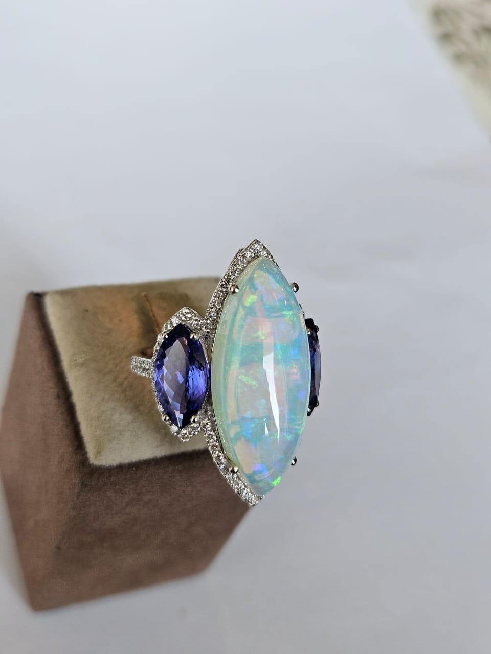 Marquise Cut Set in 18K Gold, 10.07 carats Ethiopian Opal, Tanzanite & Diamonds Cocktail Ring For Sale