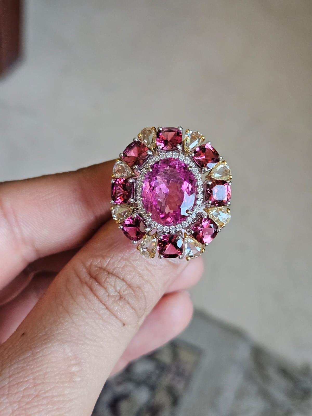 A very beautiful & gorgeous, Art Deco style, Rubellite Cocktail Ring set in 18K Rose Gold & Diamonds. The weight of the centre, oval shaped Rubellite is 5.89 carats. Other Rubellite weight is 4.39 carats. The combined Diamonds weight is 2.08 carats.