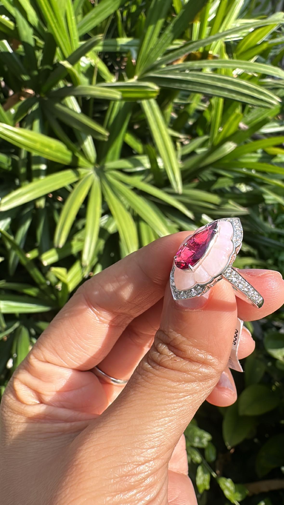 A very gorgeous and beautiful, Pink Opal & Rubellite Engagement Ring set in 18K White Gold & natural Diamonds. The weight of the pear shaped Rubellite is 1.05 carats. The weight of the Pink Opal is 1.84 carats. The Diamonds weight is 0.39 carats.